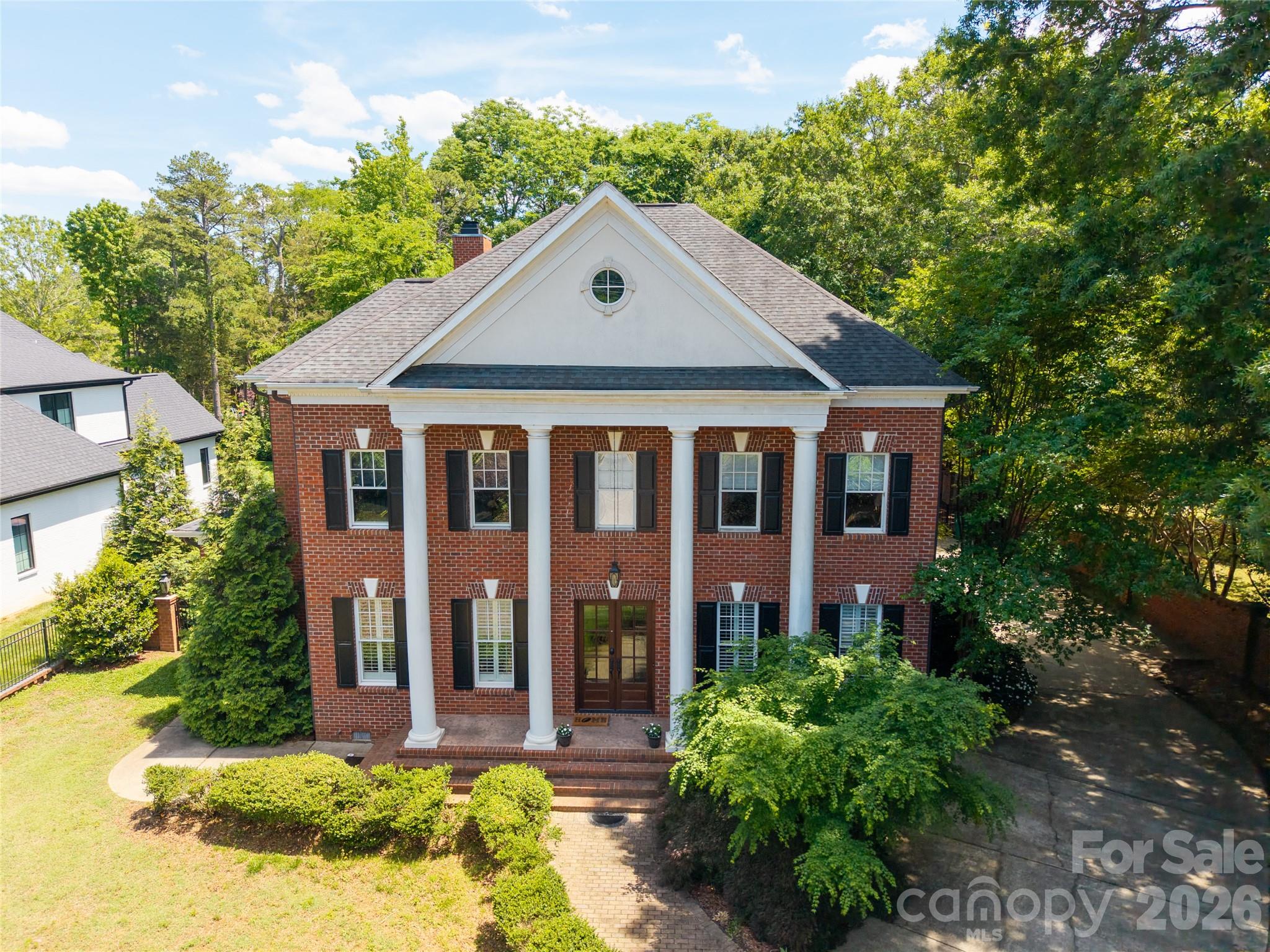 Classic Elegance !!!  Custom built Georgian home on private half acre lot.  Ideal for entertaining.  This Luxury residence boasts extensive moldings and luxury finishes including coffered ceilings and open floor plan.  There has been extensive remodeling and added heated square footage in addition to the floorplan attached.  Chef's Kitchen with huge island, 6 burner ss range, bosch dishwasher and oversized granite island. Formal dining room seats 8-10 for holiday gatherings. Features include entire home water filtration system, as well as an elevator, and central vac. For convenience this home has laundry facilities on both levels.  Guest suite on main level.  Hardwoods throughout entire home. Gated entry.  Amazing, private, level yard has brick privacy fence. Generous rear covered porch is ideal spot to relax after a long day. Encapsulated crawl space to ensure a dry environment. New (2025) Heat and A/C units on first floor. This elegant home is a must see!