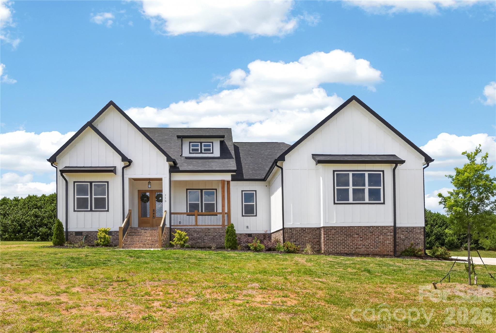 Welcome to Deer Brook Country Club—one of those neighborhoods that just feels good when you pull in. Clean, quiet, homes with space between them, and no heavy HOA breathing down your neck.

This brand-new home offers 2,609 sqft, 4 bedrooms, and 3.5 baths, but what really makes it stand out is how easy it is to live in. You walk in and it just makes sense—good light, open layout, no weird wasted space.

The kitchen is set up for real life. Two-tone cabinets that give it some character, stainless steel appliances, plenty of counter space, and a walk-in pantry that actually holds everything without cramming. It opens right into the living area, so you’re always connected whether you’re cooking, hosting, or just hanging out.

The living space feels open but still comfortable—not oversized and empty, just right.

The owner’s suite has its own space and privacy, and the bathroom feels a step above with floor-to-ceiling tile, a clean modern look, and room to move around without feeling tight.

And the lot is where this one really separates itself—.59 acres. You’ve got a covered back porch plus enough yard to actually enjoy it. Space for gatherings, kids, or just not being right on top of your neighbor.

Deer Brook gives you that more upscale feel without the restrictions, and being in Shelby means you’re getting more house and more land for your money.

If you’ve been touring homes and everything feels the same, come see this one. It just feels different in person.