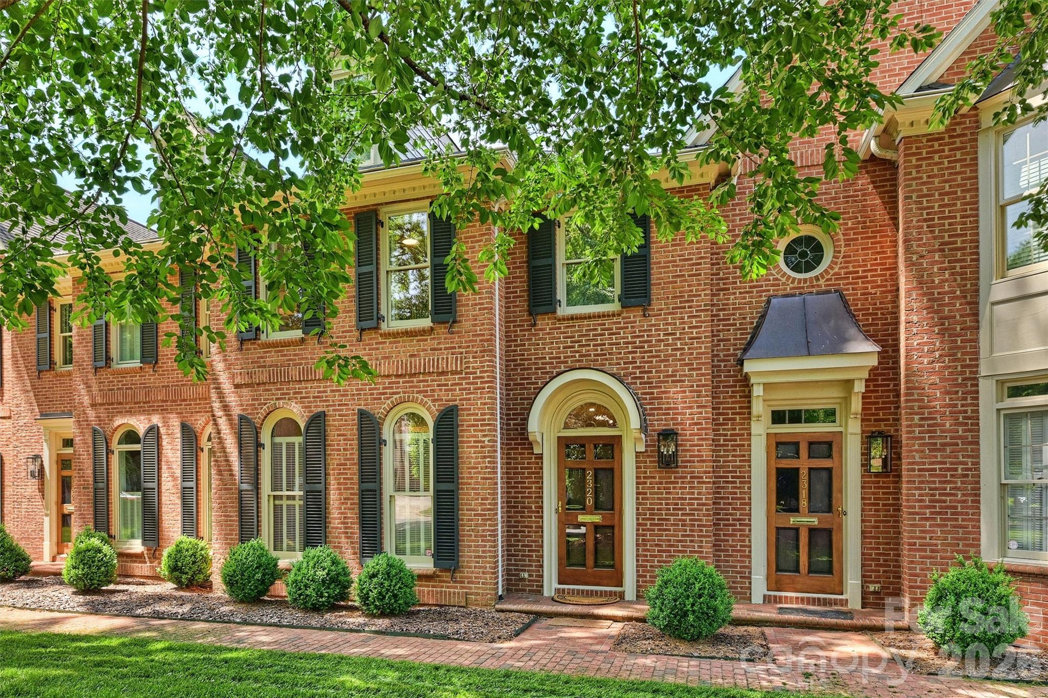 New price and incredible value in beautiful Myers Park! Selwyn Green townhome at the corner of Queens Road West and Selwyn Avenue in one of Charlotte’s most desirable locations. This special home features 9-foot ceilings downstairs, beautiful moulding, 2 fireplaces, and hardwood floors. Updated kitchen with new appliances, lighting and quartzite countertops. Upstairs are 2 spacious bedrooms with private baths and walk-in closets. Large primary suite features a fireplace and built-ins, plus plenty of flexible space for a sitting area, home office, or workout spot. Ensuite updated bath with double vanity, walk-in shower and abundant closet space. Convenient rear entry from the attached 2-car carport through a charming brick-walled courtyard. Walk to Freedom Park, Reid’s, Selwyn Pub, greenway trails, Park Road Shopping Center and more!! Only 9 units at Selwyn Green with self-managed HOA! Don’t miss this rare opportunity at new, adjusted price.