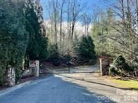 Interior home site with mountain and lake views featuring a deeded boat slip (#39) at the community dock. Located in a gated community within walking distance to the dock and community pavilion. The Pavilion has a fireplace, picnic area and grills for your enjoyment. Great opportunity to enjoy Lake James living

Gated community with community well system in place but septic is needed.
$2000 community initiation fee due from buyer at closing