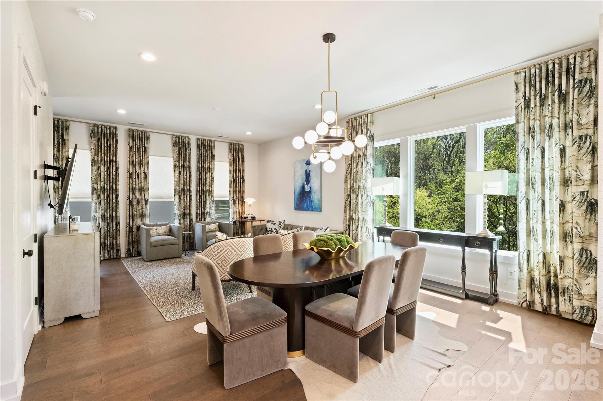 Privacy, greenery, and backyard space abound in this duet that feels like single family! Ideally located along Hawthorne Lane, this like-new townhome style condo offers the perfect balance of style, convenience, and livability—just minutes from the vibrant energy of Plaza Midwood and the business and cultural hub of Uptown Charlotte. Whether enjoying nearby restaurants, coffee shops, and local boutiques or commuting with ease, the location delivers on every level. A convenient footpath connects the back yard to Thomas Ave.

Thoughtfully curated with the eye of a professional interior designer, the home features elevated finishes and cohesive, on-trend design throughout. Mohawk engineered hardwood flooring runs seamlessly across all living spaces, creating warmth, durability, and a clean, modern aesthetic.

Unlike many properties of its kind, this townhome boasts a rare, large, flat, fully fenced backyard—ideal for entertaining, pets, or simply enjoying private outdoor living.

The property is part of an intimate three-unit HOA, composed of duet-style townhomes deeded as condominiums, offering a low-maintenance lifestyle with a sense of privacy and exclusivity. 

Combining like-new condition, designer finishes, and an unbeatable in-town location, 1500 Hawthorne Lane presents a compelling opportunity to enjoy the best of Charlotte living.