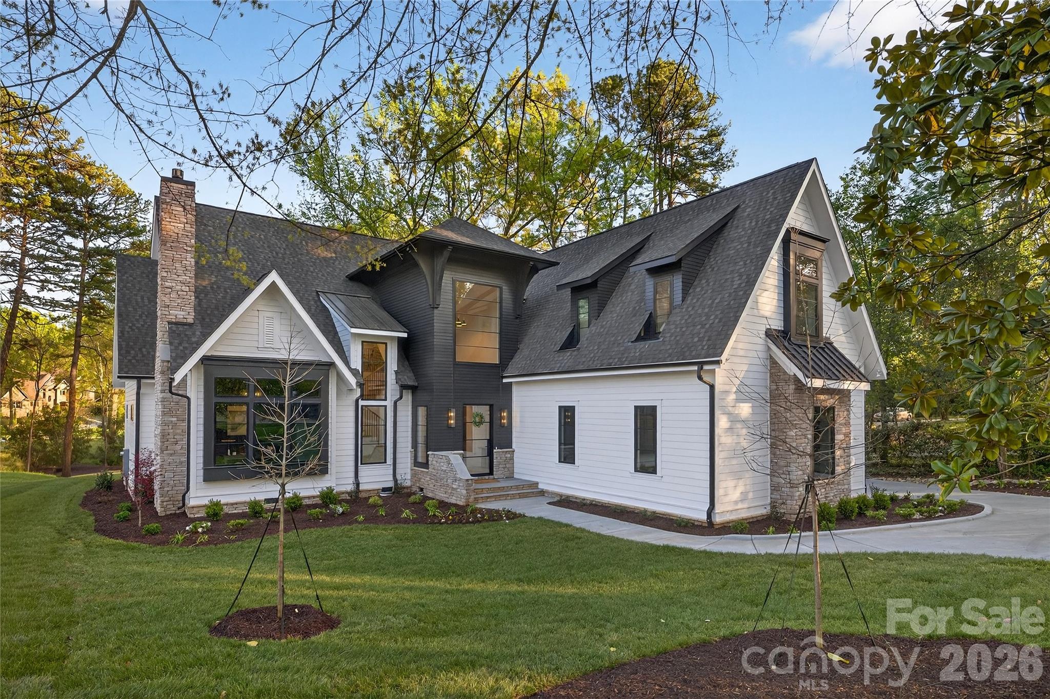Live where timeless design meets everyday comfort. This Copper Builders home was crafted for the way you truly live—with a serene primary suite on the main floor, a gourmet kitchen complete with scullery and wine storage room, and a spacious 3-car garage for effortless coming and going. Thoughtfully connected spaces make hosting and relaxing equally natural. Nestled minutes between Cotswold Village and The Shops at Strawberry Hill, you’ll enjoy Charlotte’s best dining, shopping, and schools just beyond your doorstep. Move-in is estimated for early 2026. Built by Copper Builders—3x Builder of the Year and trusted for homes that feel as good as they look. Schedule your private tour today and start envisioning life here.