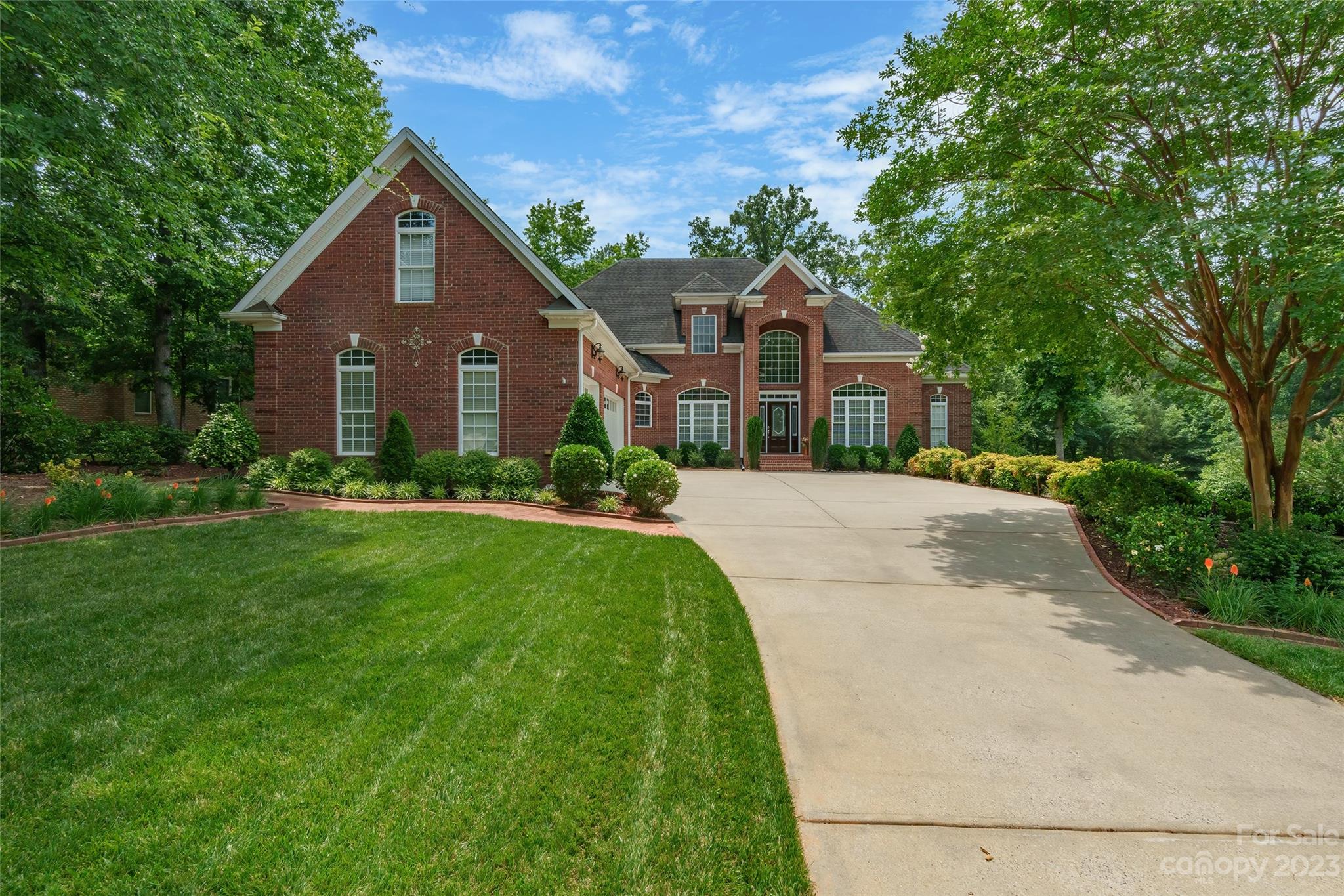 One of Rock Hill's most desirable neighborhoods, Laurel Creek. Beautiful custom brick home with dramatic entrance that sets the tone. Impressive floor to ceiling windows and 9' foot ceilings through out. Great entertaining home with formal dining and a living room with peninsula fireplace that is shared with the open great room with built-ins. Huge granite kitchen sure to please any chef! Large work island is granite with breakfast bar, offers double oven, and electric cook top. Beautiful primary bedroom on main w/ double bathrooms, one leading into the office that could be potential 2nd bedroom. Huge screened porch wraps around backside of home and patio overlooks a very private and manicured backyard. Upstairs houses three secondary bedrooms and two full baths. Other noteworthy features include in ground irrigation, triple car garage, and street ends with a cul-de-sac! Walk in Crawl space is sealed with plenty of room for extra storage.