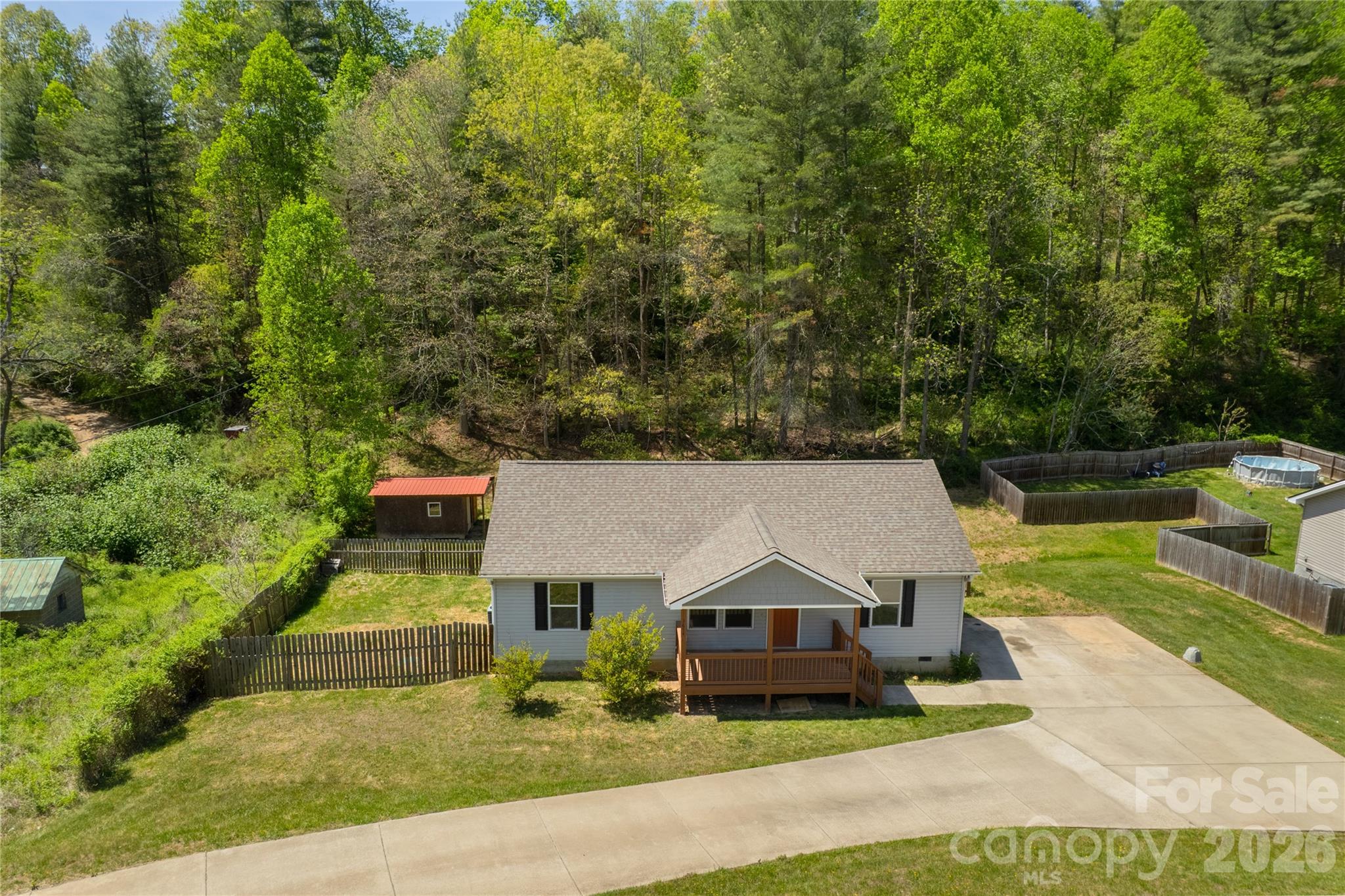 I am a younger, open, one level, split floor plan, accessible home with modern appliances and gladiolus that bloom in multiple colors! You have your choice to sit on my front porch and back deck while you have your morning coffee, grill out, host friends and family or sip a cool crisp Diet Coke in the afternoon. I have a nice, tall fence surrounding me that loves to keep your furry friends safe! You gotta check me out today! With ample parking, a primary suite, nice sized bedrooms, dedicated laundry space, a huge pantry off the kitchen and great closet storage, theres not much more you could ask for. Also, did I mention I’m down where Leicester highway is still two lanes? It’s nice and quiet with a little country! I am also offering a home warranty or credit for any buyer! Come see me today!!