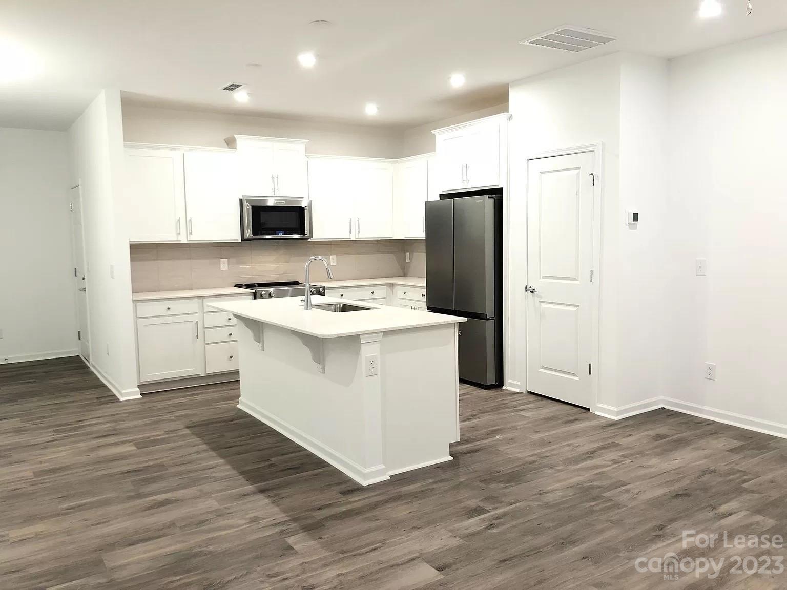 Brand New 2-Story Modern Townhome! The open-concept living area is full of natural light, The main floor & stairs have LVP flooring. The Gourmet kitchen has White cabinets, Tile Backsplash, Quartz countertops, a spacious Island, and Stainless Steel appliances.
 The Family room & Primary are pre-wired for cable.  
Spacious Primary with trey ceiling, ensuite with dual sinks, and walk-in closet.  All Bedrooms and Family Room have ceiling fans/lights.  Covered Front porch and back patio with 1 car garage and driveway. 
Two Additional Bedrooms with Full Bath, ample closet space, and a Laundry Closet with a New Washer & Dryer included.
Located in a very desirable location, the elementary school is within walking distance, with shopping and dining options near Concord Mills Mall, I-85, and I-485.  The community includes lawn service, water, trash, and a playground. Schools are for the current school year 2023/2024.