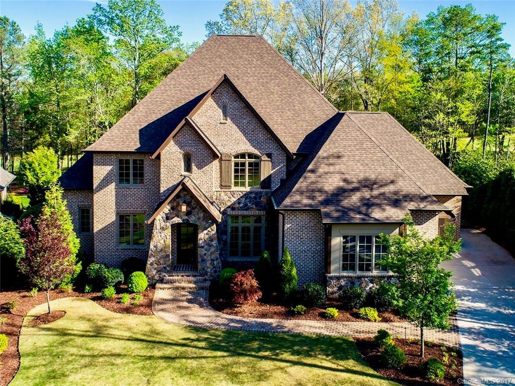 Beautiful Custom Home in Springfield Community, on the golf course with a great view of the 11th. fairway. This home has an abundance of custom features, including disappearing slider that opens up great room to the screened in porch, central vac, heated-cooled garages, full-length Subzero wine fridge & Subzero refrigerator, built in ice maker, heated master bath floors, mosquito misting system, to name a few.  Wooded park area in front of the home lends for great views from front windows.