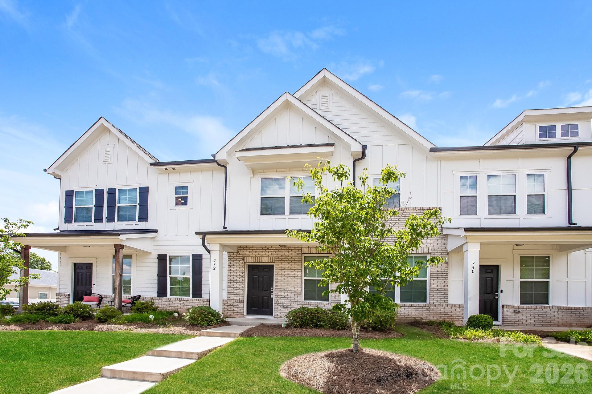 Desirable Auden community off Herlong Ave! Almost new, built in 2023, three bedroom townhome with rear load two car attached garage. Main floor has hardwoods throughout, open floor plan, all white kitchen with peninsula for extra seating, SS appliances, 5 burner gas stove. Upstairs the two guest rooms (both with walk in closets) share a large hallway bath with tub/shower combo. Primary bedroom features two separate walk in closets, en suite bath with dual sinks, glass enclosed walk in shower. HOA maintains lawn.