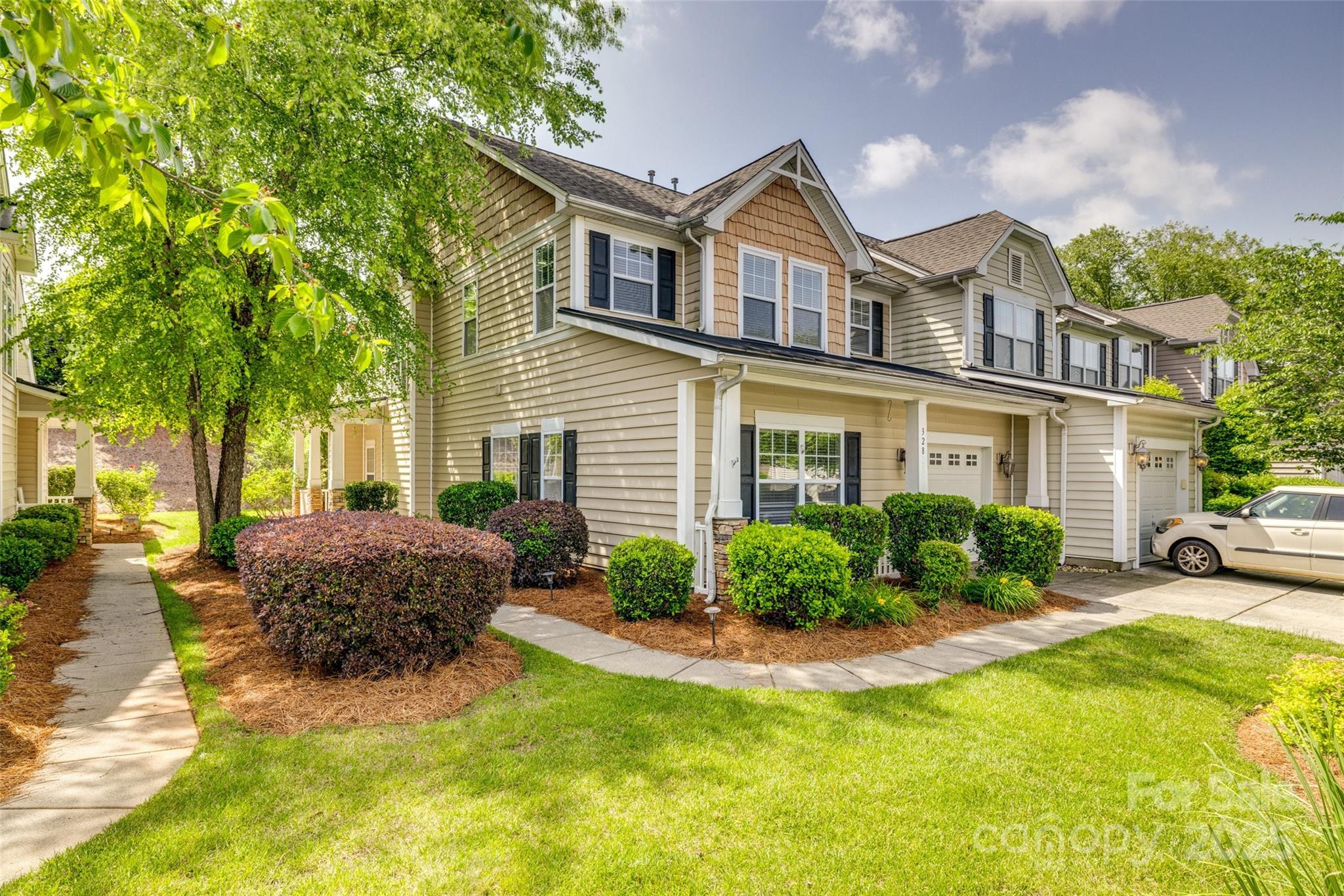 Welcome home to this charming 3-bedroom, 2.5-bath END-UNIT townhome featuring an open floorplan and great use of space throughout. The main level includes a bright living area with a cozy gas fireplace, a kitchen with granite countertops, stainless steel appliances, and a convenient primary suite with a spacious en-suite bath and an oversized walk-in closet. Enjoy relaxing on the adorable front porch or the covered back patio. Upstairs, you’ll find two additional bedrooms, a full bath, and a versatile loft—perfect for an office, playroom, or second living area. With plenty of storage throughout, low-maintenance living, and access to a community pool, this beautifully maintained end unit has it all. Don’t miss your chance to make it yours!