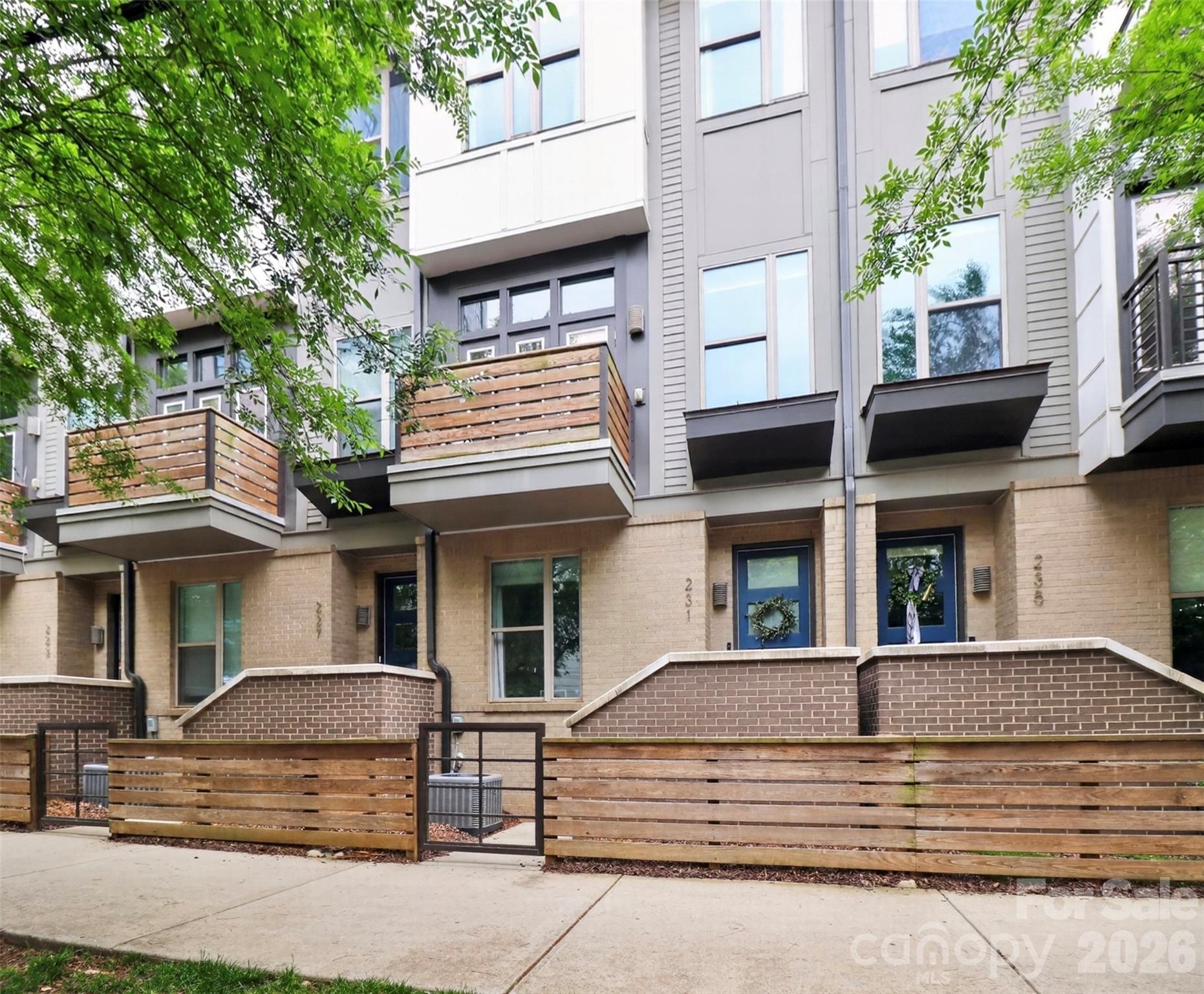 Stunning townhome in the heart of South End! Enjoy easy access to the city’s top restaurants, bars, coffee shops, Atherton Mill, the light rail, and the Charlotte Rail Trail - all just steps away. Inside, you’re greeted by an open foyer leading to a bedroom, full bathroom, and oversized one-car garage complete with a Tesla charging station. Head upstairs to the main level featuring a gorgeous kitchen with quartz countertops, a convection range, hardwood floors, and a spacious island with seating. Enjoy coffee from your balcony overlooking South End or meals in the dedicated dining area filled with sunlight. On the upper level, you’ll find the primary suite, laundry closet, and an additional spacious bedroom with its own ensuite bathroom and walk-in closet. The top floor offers a flexible bonus space that opens directly onto the rooftop balcony, perfect for entertaining. This floor also has additional storage space. You’ll love this move-in ready home that’s been beautifully cared for and updated with gorgeous paint colors throughout. Plus, the washer, dryer, and refrigerator will all remain! Homes in Helix are rare to come to market, so don’t miss your chance to tour this one.