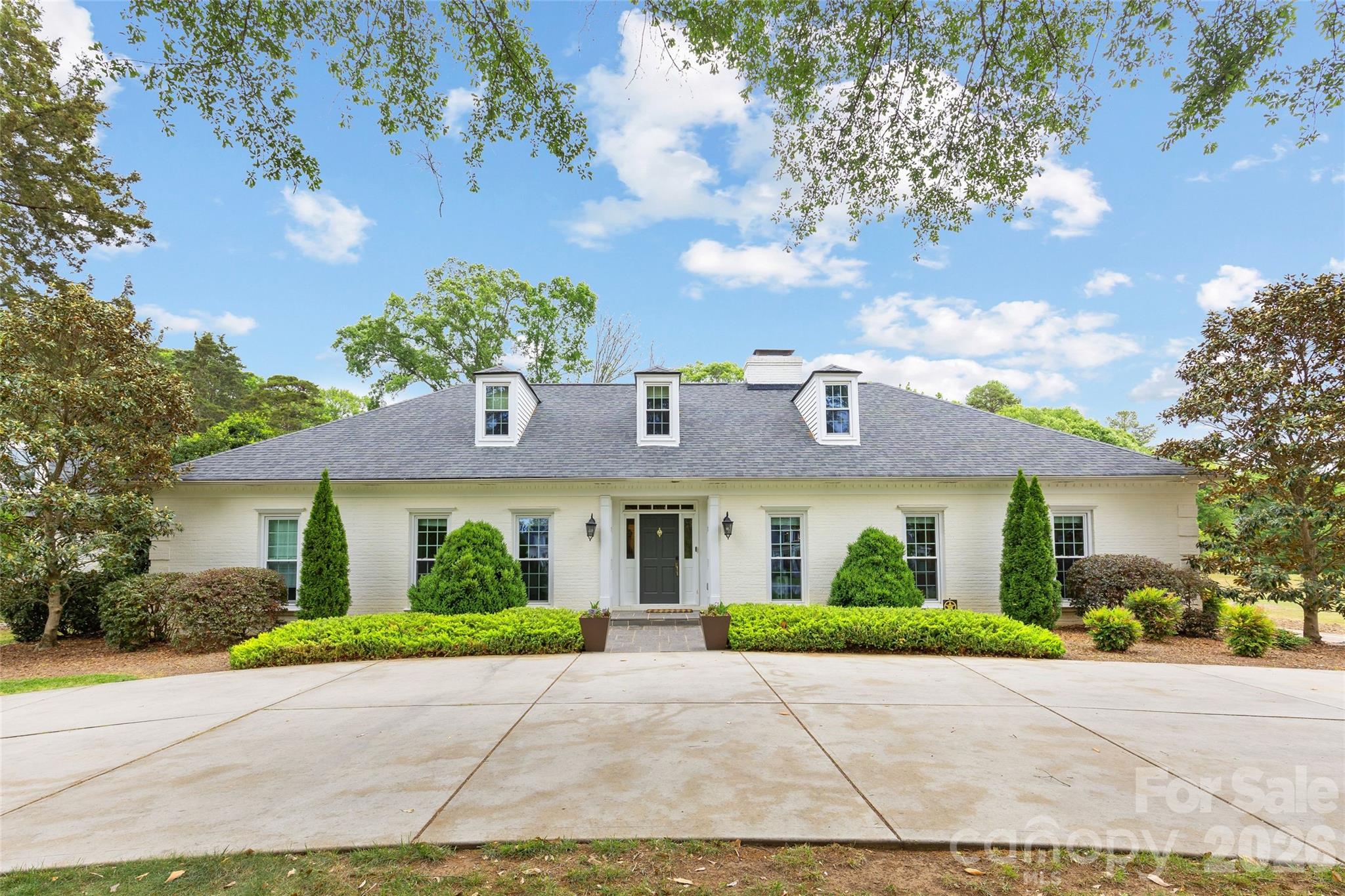 3921 River Ridge Road presents a rare opportunity to renovate, expand, or build the home of your dreams on just over an acre in popular Montibello, This classic brick 1.5-story home offers 5 bedrooms, 3.5 baths with generous sized kitchen, living and dining spaces. Surrounded by mature trees and established homes, the spacious lot provides the perfect setting for a luxury renovation or exceptional new construction. Ideally situated just off Carmel Country Club golf course.