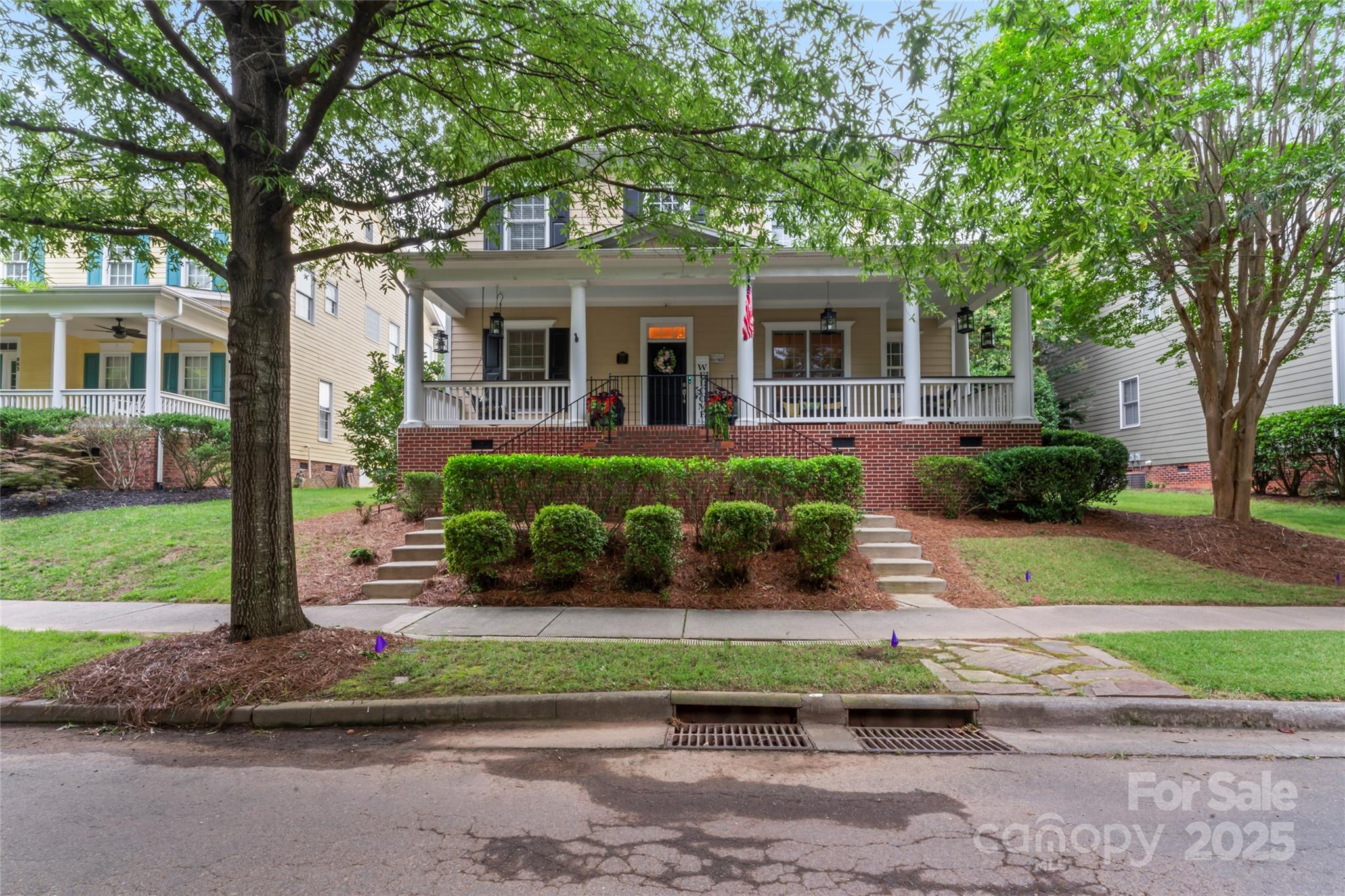 Walking up to this Charleston Style home with HUGE front porch and mature tree-lined (with sidewalks) street, you KNOW you are home!  Entering, you are greeted with 10' ceilings and custom millwork (think crown molding, baseboards and built-ins throughout). Hardwood floors run throughout the main floor living area which includes a dining room & den that can also be an office.  The updated kitchen features quartz countertops, freshened cabinets w/soft close hinges, updated lighting & oversized sink!  The open floorplan family room has walls of built-ins & a gas fireplace.  The large primary bedroom & updated en-suite featuring over-sized walk-in shower & stand alone tub is also on the main floor.
Upstairs includes a loft area, bonus room, 3 bedrooms and 2 full baths.  Outside is a fenced in entertainers dream and detached 2.5 car garage! 
Centrally located just steps away from the elementary school, Baxter Y, pocket parks and Main Street, this location is what you've been waiting for!