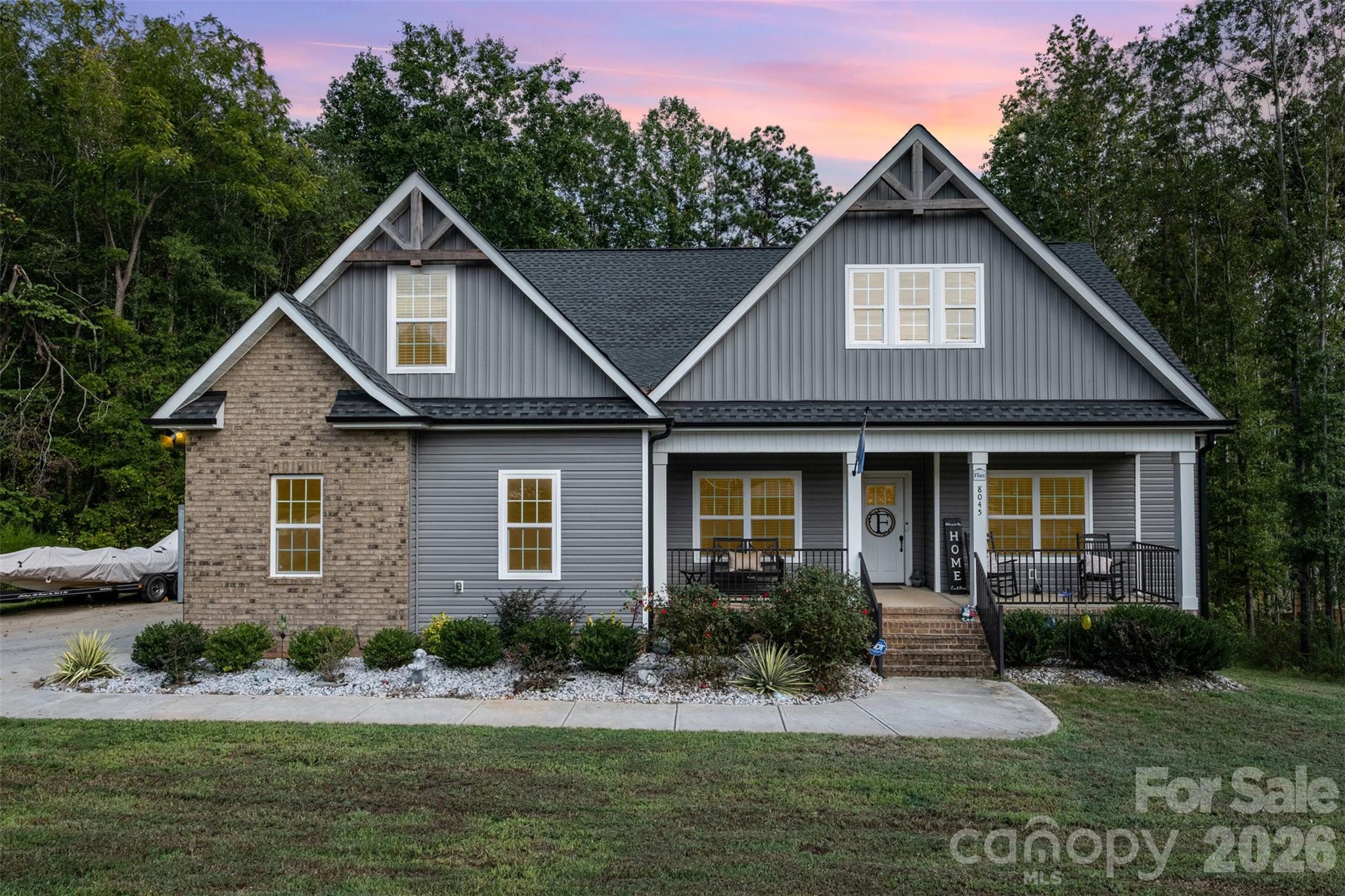 Tucked away in a quiet cul-de-sac, this beautiful home sits on a generous 1.21-acre lot in the highly desirable Sanders
Landing community—part of the top-ranked Clover School District. Designed with comfort and style in mind, the home
features a spacious primary suite on the main level, an open floor plan with a cozy fireplace, and elegant coffered ceilings
in the living area. Enjoy peaceful wooded views from your screened-in porch, perfect for morning coffee or evening
relaxation. Luxury touches abound, including luxury vinyl plank flooring, quartz countertops, and a tankless water heater
for energy efficiency. A variety of unique ceiling designs add character throughout the home. Upstairs, you'll find a private
bedroom with a full bath—ideal for guests—as well as a large media room perfect for movie nights, a home office, or play
space. If you’re looking for privacy, space, and modern finishes in one of Clover’s best communities—this is the one!