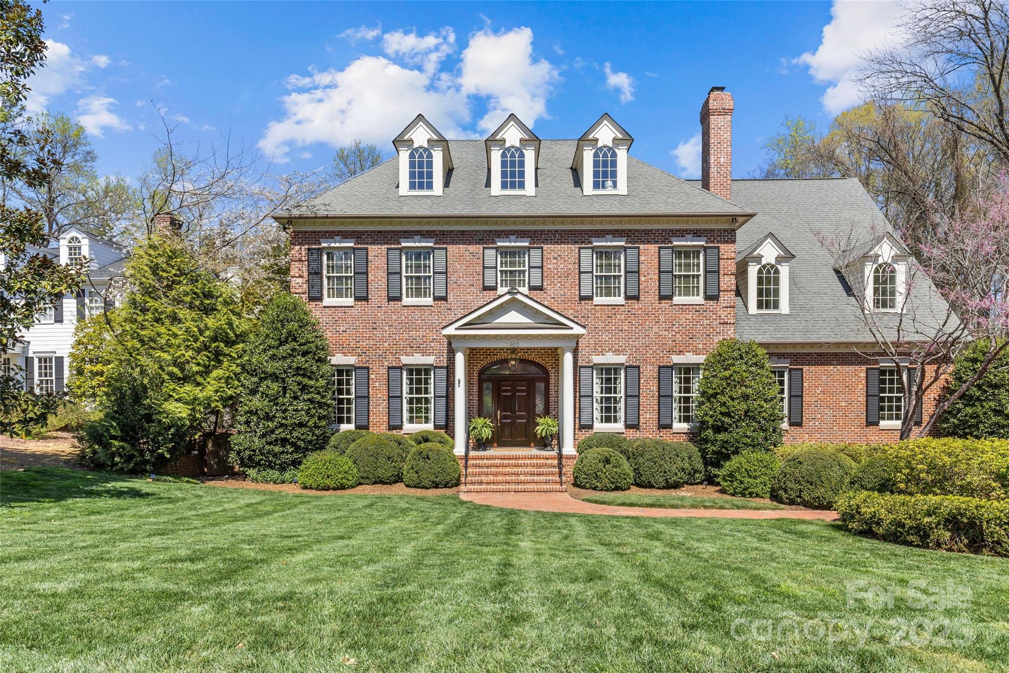 Stunning custom-built Georgian brick home in the heart of Foxcroft offers 8,600+ sq/ft of luxurious living space on a sprawling half acre lot. Home features high ceilings (11' main, 10' 2nd), exquisite moldings, and an open floor plan ideal for entertaining. Elegant formal living and dining rooms plus family room with coffered ceiling. Gourmet kitchen with custom cabinetry, high-end appliances, walk-in pantry, wet bar/ butler's pantry, and sunny breakfast room. Primary suite boasts his-and-her bathrooms and dual walk-in closets! Also on the 2nd level enjoy the bonus room w/ wet bar, media room, and 3 secondary bedrooms all with en-suite baths. 3rd level offers an add’l 2 bedrooms and huge rec space! Outside, enjoy the covered porch with fireplace that overlooks the immaculate flat yard and bluestone patio with grilling cabana and firepit. Attached 3-car garage. Unbeatable location minutes to all that SouthPark has to offer, nestled in one of Charlotte's most desirable neighborhoods.