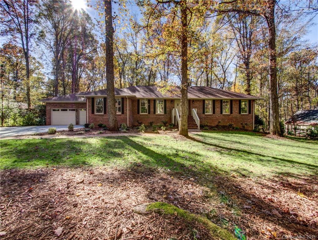 Completely remodeled  home in the beautiful gated golf community of River Hills. Home features 5 Bedrooms and 3 bathrooms, a huge great room with a stacked stone fireplace. This home features new hardwoods, tile and  carpet. New windows, new kitchen with granite counter tops, custom cabinets and SS appliances. A huge basement with an entertainment bar, Basement features a family room with a stacked stone fireplace bonus area with built in cabinets and shelves and large office. THIS IS A MUST SEE