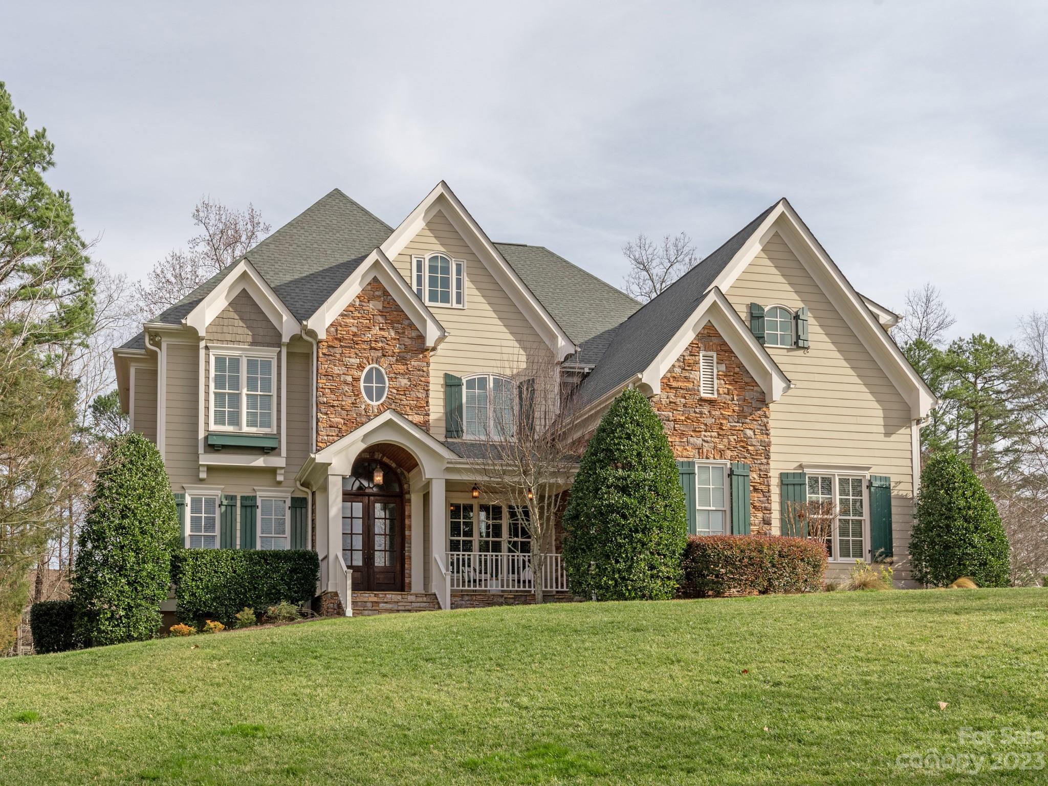 Stunning Custom home in the highly sought after Springfield Community. Located in a coveted cul de sac location on one of Springfields LARGEST lots (.74 acres).  From the moment you arrive you will appreciate its Grand curb appeal and sophisticated southern charm.  Double Wood front doors; relaxing flagstone front & back porches & 3 car garage. This home is full of LIGHT to enjoy. Main floor: Elegant two story foyer;natural toned floors;Executive Office, Great Room, Bonus Rm& Butlers include built in custom cabinets; heavy moldings throughout; a separate first floor guest ensuite & a desirable open floorplan. Upstairs: Primary Suite w/sitting area, fireplace & 2 Walkin closets; 3 add'l bedrooms + Bonusrm. Third Floor: Bedroom/Flex Space w/full bath as well as a generous Bonus Rm. Springfield Amenities Include: Membership to Anne Springs Greenway; Pool; Tennis, Pickleball courts;Playground;Clubhouse;Pocket Parks & Fitness Center. Seperate 18 hole Public golf course in community.