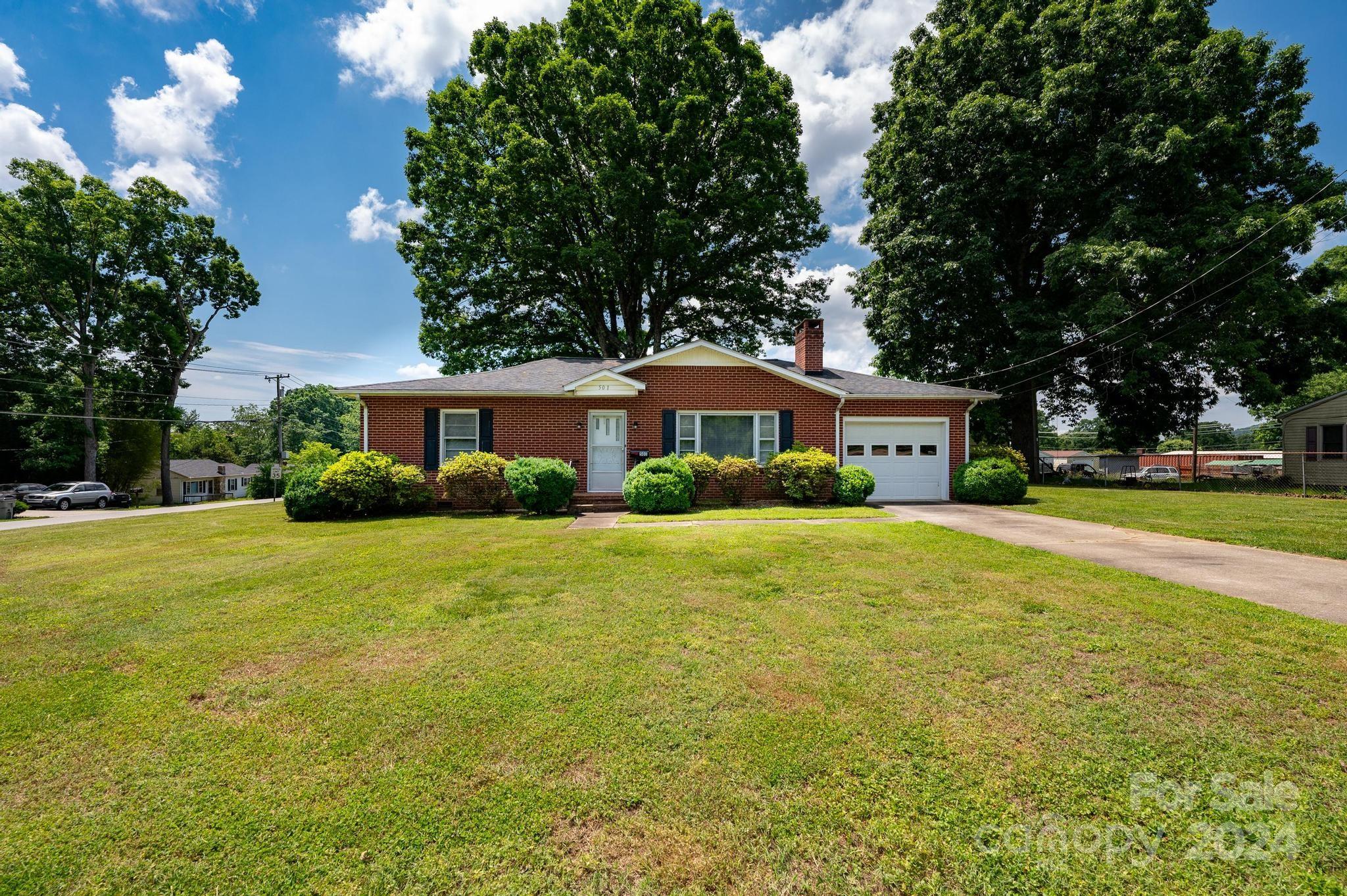 Discover this well-maintained full brick 2-bedroom, 1-bath home, nestled on a half-acre lot in Lenoir. This immaculate property boasts timeless appeal and a spacious yard, perfect for enjoying serene outdoor living.