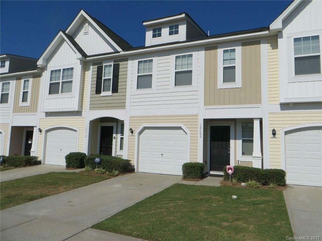 Three bedroom town home with a garage in the heart of Steele Creek! Light, bright with fresh paint throughout. Open Kitchen/Dining/ Great Room area, fireplace w/ tv niche. Sliders to rear patio.  Kitchen has good cabinet/counter space + Pantry, tile back splash. Handy serving/breakfast bar. Vaulted Master BR has WIC & private  bath w/ long dual sink vanity. Two good-sized secondary BRs w/ vaulted ceilings. Large storage closet on main + addt. storage under stairs. Enjoy the community pool!