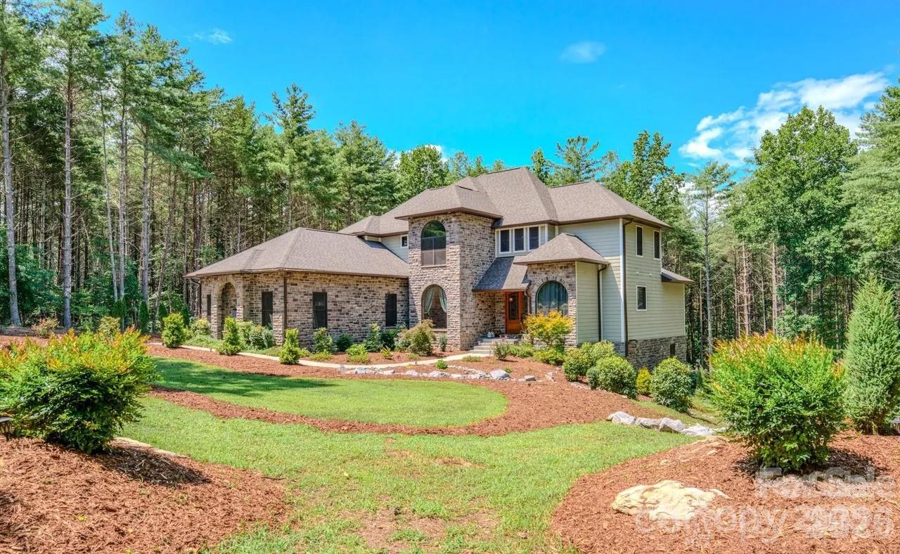 Beautiful home in sought after Southpointe development. The marina and club house are within walking distance of the home. Total 6 bedrooms, 5 baths, boat slip, hot tub, cattery that can be converted to a sauna, walk out basement, fenced back yard and more. 11 miles to Morganton and 17 miles to Marion. Close to hiking and biking trails, ski resorts, wineries, breweries and anything else you are looking for in the NC Western Mountains. If you are looking for a home to lay down roots, investment, or weekend lake get away this is the perfect property.  Showings require a 24-hour notice.