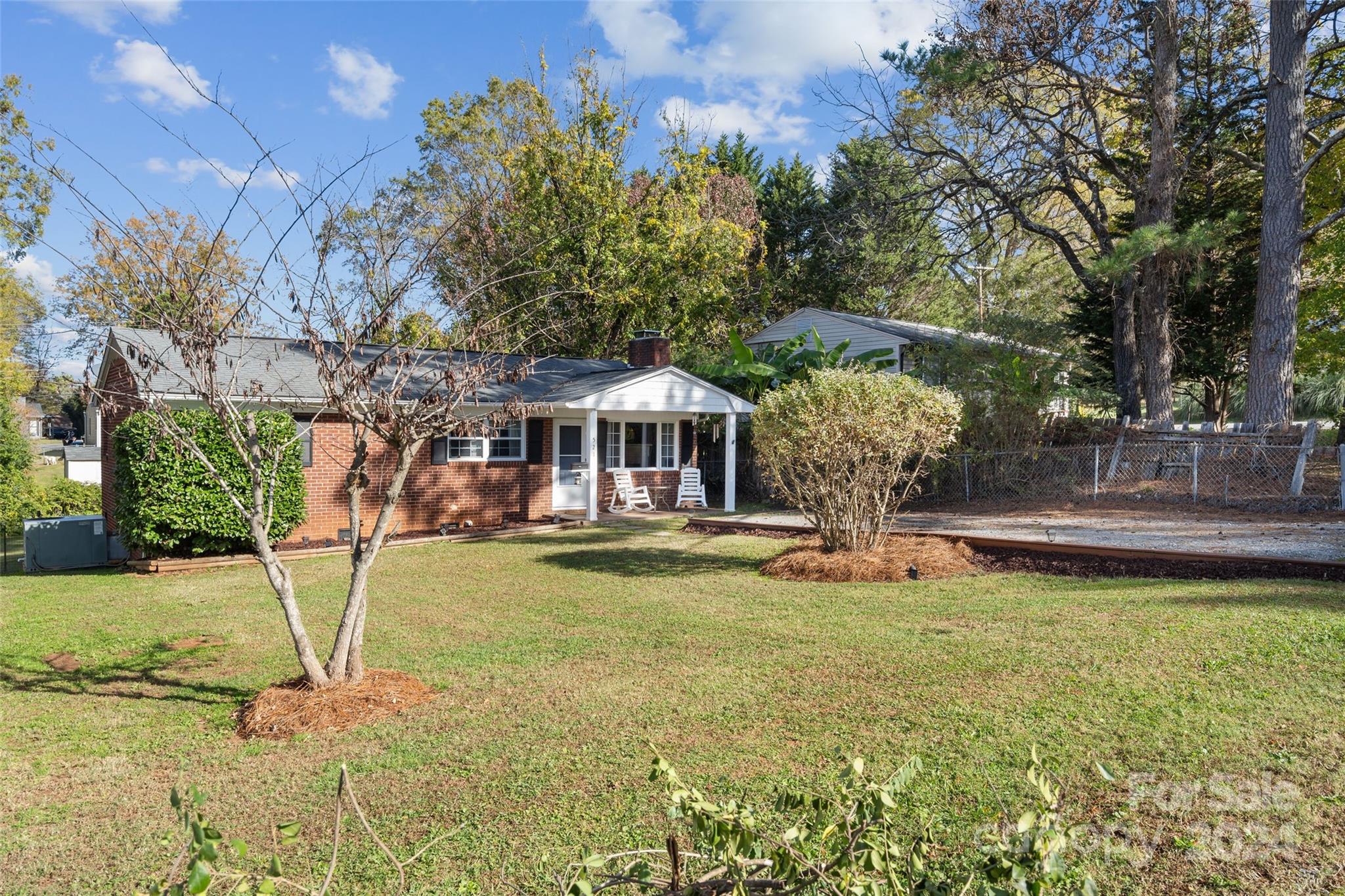 Welcome to this adorable 3-bedroom, 1.5-bathroom full-brick ranch nestled in the heart of town. Enjoy the perfect blend of convenience and comfort, with shops, cafes, and community events just a short walk away. Step inside to find a cozy layout, ideal for making memories with family and friends. The living spaces boast timeless charm, while the bedrooms offer the perfect retreat for rest and relaxation.The fully fenced backyard is a private oasis, perfect for play, gardening, or simply unwinding. A spacious storage building provides room for all your outdoor essentials or hobbies. This delightful home offers the best of both worlds: a peaceful retreat in a vibrant, walkable location. Don’t miss the opportunity to make it yours!