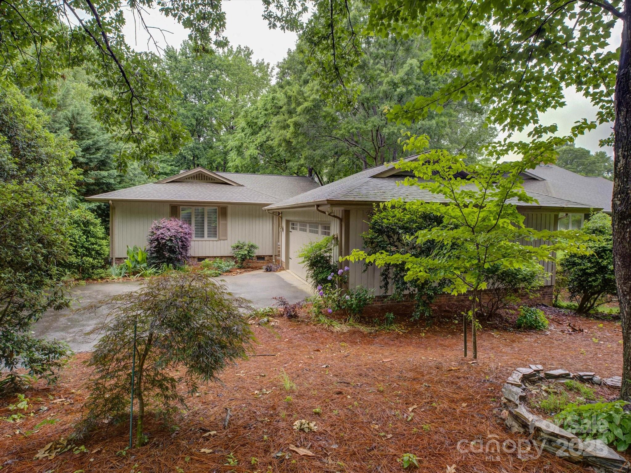 A Golfer’s Paradise! Welcome to a wonderful location in River Hills-minutes away from The Country Club & Marina. River Hills is a premium gated community w/ club access to golf, tennis, pickleball, pool, and the marina. This lovely home features 4 beds, 3.5 baths, & just under 3700 sq ft. Enter to an open great room w/ new wood flooring. Formal dining room flows into large kitchen, w/ granite countertops & SS appliances. Relax in expansive heated & cooled sunroom overlooking trees & foliage. Deck & patio on the back. Main level primary suite and guest suite. Finished basement includes 2 beds, flex room, & a secondary living space. Lots of storage in walk-up attic & 700 sq ft in unfinished basement space. Recent updates include: New Upstairs HVAC, New Garage Door, Upgraded Electrical Panel, New Hardwood Floor in upstairs Den, repairs & replacements throughout based on previous Inspection Report. This beautiful setting & ideal location provide incredible place to call HOME!
