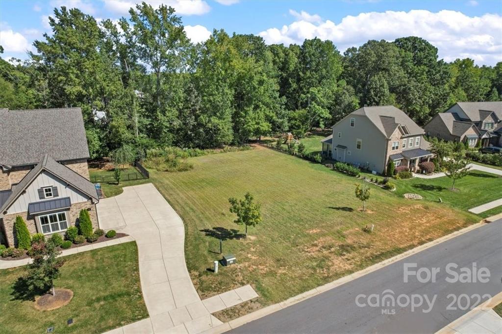 Bring your own builder and come build your dream home on the last available lot in the well established neighborhood of Rosecliff! The lot is already cleared and ready for you! Great location close to Charlotte, downtown Waxhaw, shopping, restaurants, great schools, and everything you could want. Rosecliff offers a walking trail, a community pond, and is conveniently located by Marvin Ridge Middle and High School. *No min square footage requirements, 12 month build time after arc approval, side load garages are required.*