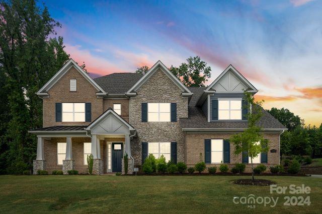 Discover luxury living in Bretagne's exclusive estates enclave. This private, gated community is ideally situated just minutes from the new Ballantyne Bowl and amphitheater, premier shopping, and fine dining. Built in 2021, this exquisite brick home boasts 5 bedrooms, 5.5 baths, including a luxurious main suite with a grand en-suite and expansive walk-in closet. Each bedroom features its own en suite bath and walk-in closet. The grand entryway leads to a spacious, open living area perfect for entertaining. The gourmet chef's kitchen is a culinary delight with double-stacked cabinets, a walk-in pantry, double oven, gas range, and stainless steel appliances. Additional main-level amenities include an office, formal dining room, and a 3-car garage. Upstairs, a loft and large bonus room offer versatile spaces for relaxation or recreation. Enjoy outdoor living on the screened-in patio, a sizable lot ideal for creating your dream backyard oasis. Bretagne residents also enjoy many amenities.