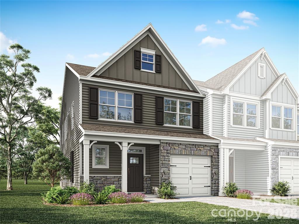 Welcome to the Cary floorplan in Downtown Waxhaw's newest townhomes! This end-unit townhome features 3 bedrooms, 2.5 baths, and an attached 1-car garage. The two-story family room features a ceiling fan, and the room offers lots of natural light. The kitchen is spacious with an island, Shaker-style, white soft close cabinets, quartz counters, tile backsplash, and stainless appliances. Beautiful and durable Enhanced Vinyl Plank flooring runs throughout the main level, and composite stair treads and metal balusters are included. All baths feature white cabinets and quartz counters. The primary suite, located on the main floor, includes a large walk-in closet, and the primary bath features double-sink vanity, a tiled shower with bench seat and semi-frameless enclosure. The upper floor features two additional bedrooms, a loft overlooking the family room, a full bath with tub/shower combo, and a large, finished bonus/flex/storage area. Other extras include a tray ceiling in the foyer & primary bedroom. Enjoy the outdoors on your covered rear porch!