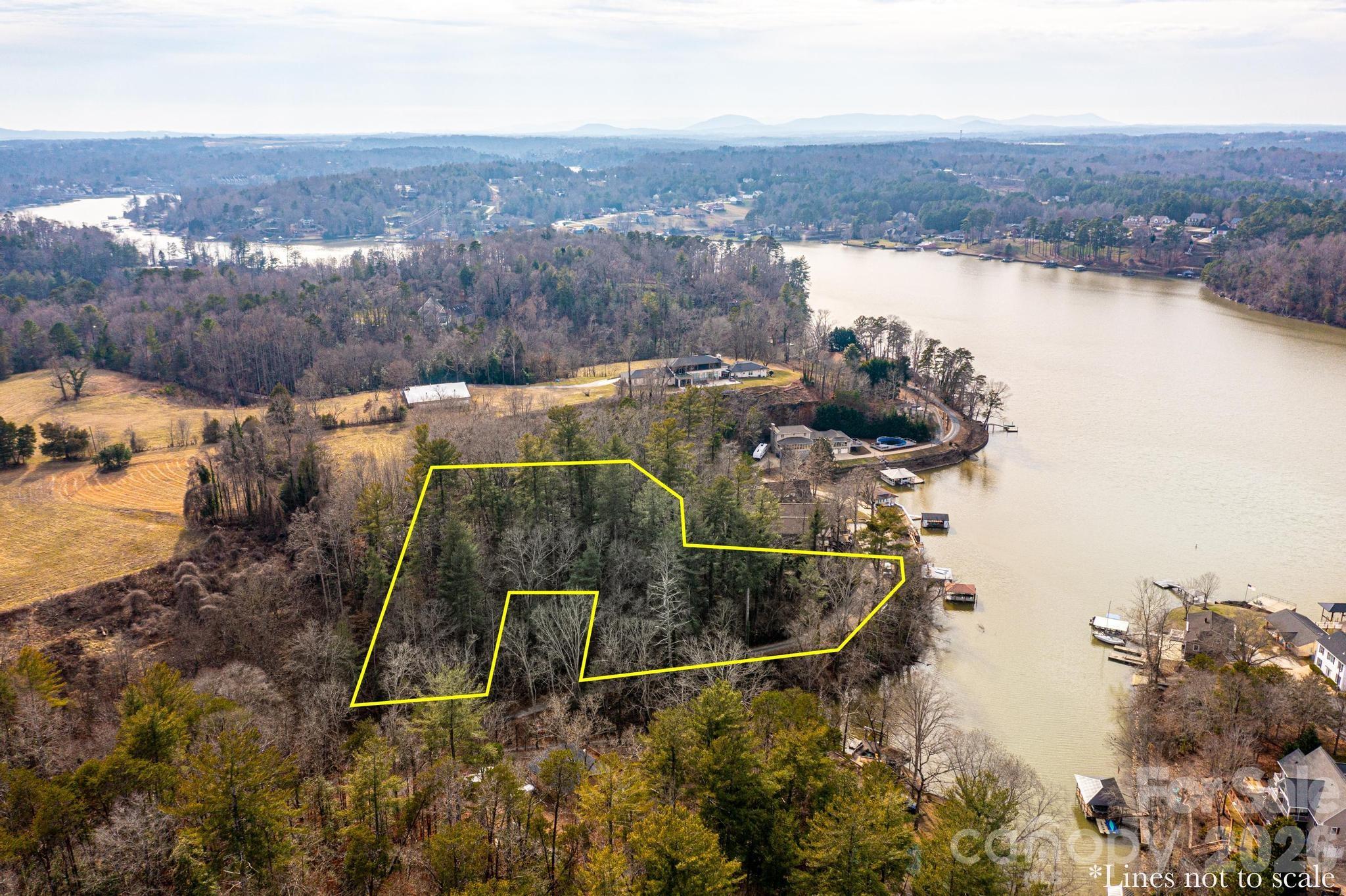 WATERFRONT LOT WITH APPROVED DOCK PERMIT_________________
Discover a truly one-of-a-kind opportunity to own a pristine waterfront lot, where unparalleled, unobstructed long-range views create the foundation for your private lakeside retreat. Without the constraints of a homeowners association, this property offers the rare freedom to bring your vision to life without limitation, serving as the perfect canvas for either a dream home or a serene getaway. The unrestricted nature of the land allows you to design and build according to your specific vision, ensuring a personalized investment that is as unique as it is promising. While the lot provides direct waterfront access and breathtaking vistas, prospective owners should note that installing a gravel driveway to reach the top or level building portion of the property is estimated to cost approximately $25,000. With its dock-ready status and the flexibility to build without compromise, this property stands as a rare find in today’s market, inviting you to embrace a lifestyle that seamlessly blends luxury, nature, and the quiet serenity of true lakeside living.