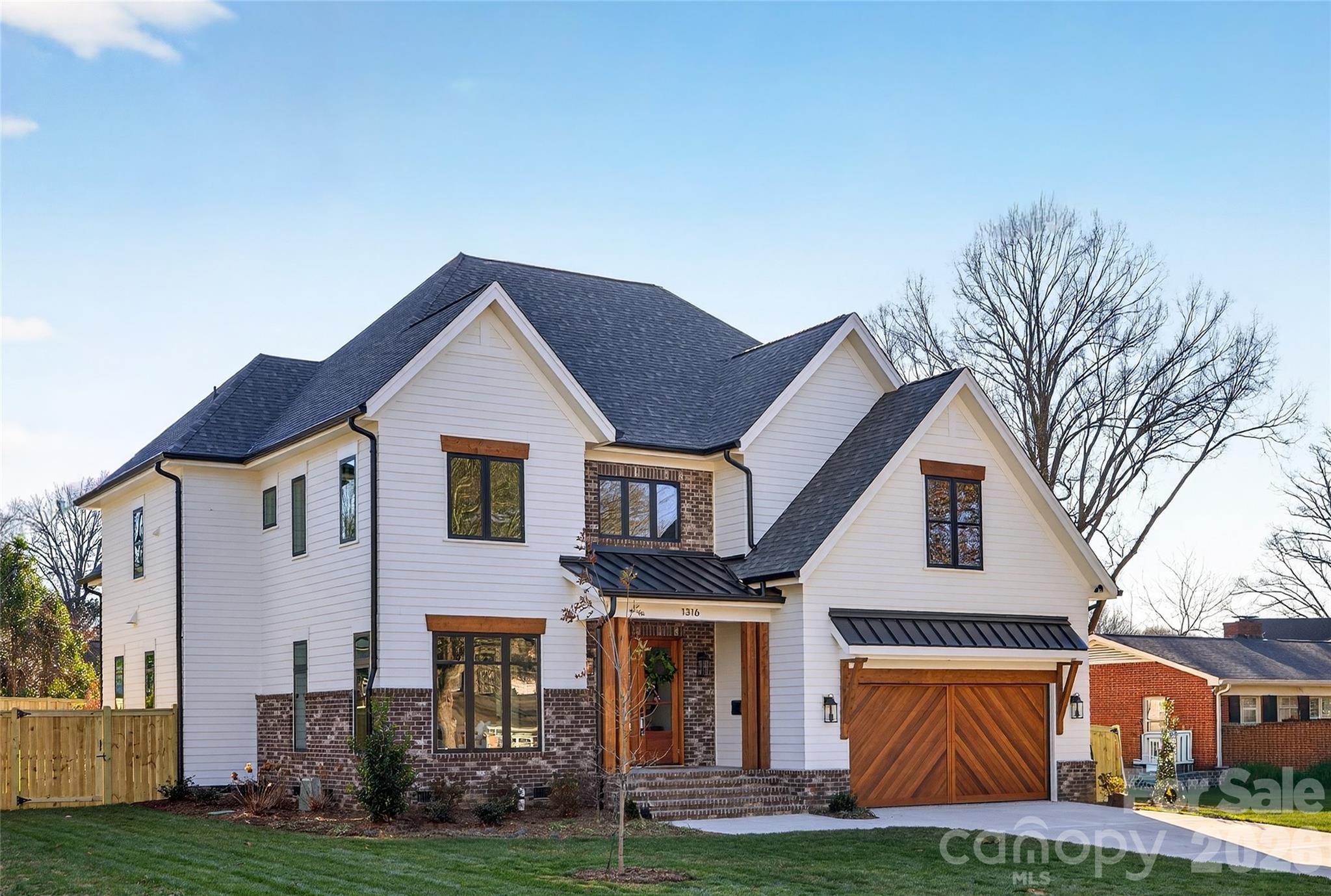 NEW BUILD. AMAZING opportunity to own a gorgeous custom built home that sits on a .31-acre beautifully landscaped and fully irrigated flat backyard. 6' fence. 5159 heated SF. 5 BRs, 6 full BAs, 1 powder room. Loaded with high-end features and plenty of space, this impressive design offers a 2-story open above Entry Hall, Dining Room, Walk-in Wet Bar, Walk-in Pantry with permanent shelving, Office with library paneling, Bedroom, Bath, Powder Bath, Drop Zone, gorgeous Chef's Kitchen with custom cabinets, SS appliances, beautiful lighting, exquisite backsplash, soft close drawers, gas cooking and large island all open to the Family Room with FP with marble surround, switch for gas logs, bookcases, and private covered rear Porch with ceiling fan, lighting, FP. Heavy trim and hardwood flooring finished in place throughout the home. Beautiful tile in all baths. Upper Level features a large Master Suite with a huge walk-in closet, Master Bath has tub, shower, 2 sinks, towel closet. Upstairs also has 3 BR suites, 2 with tubs and all 3 with showers. Laundry Room has a tall folding table, sink. 3rd Level is a finished Bed/Loft with a closet, wet bar, sink, refrigerator drawer, ice drawer, and a bath with shower and vanity sink. Fabulous opportunity to live in a brand new home in a great south Charlotte school district! Wonderful location--10 minutes to uptown Charlotte, walking distance to restaurants, grocery store, parks, cinema, post office. 2026 Schools, Selwyn Elementary School, Alexander Graham Middle School and Myers Park High School. Garage with epoxy flooring, door to the trash can pad. Contractor shall warrant the home for 1 year from the date of move in and a 10-year structural warranty beyond the builder's 1-year warranty.