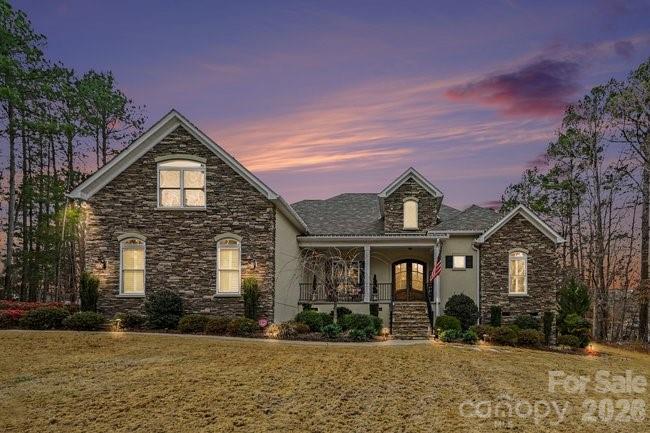 Beautiful Home in the desirable Wildwood community of Fort Mill! On a beautifully maintained 2-acre lot,Featuring 3 spacious bedrooms and 2.5 bathrooms,Beautiful hardwood floors, and a seamless flow throughout.Home is equipped with premium features including a water softener system,encapsulated basement, in-home stereo system, and irrigation system.Step outside to your own private retreat complete with a sparkling outdoor pool and hot tub, all surrounded by peaceful acreage. This is a must see!