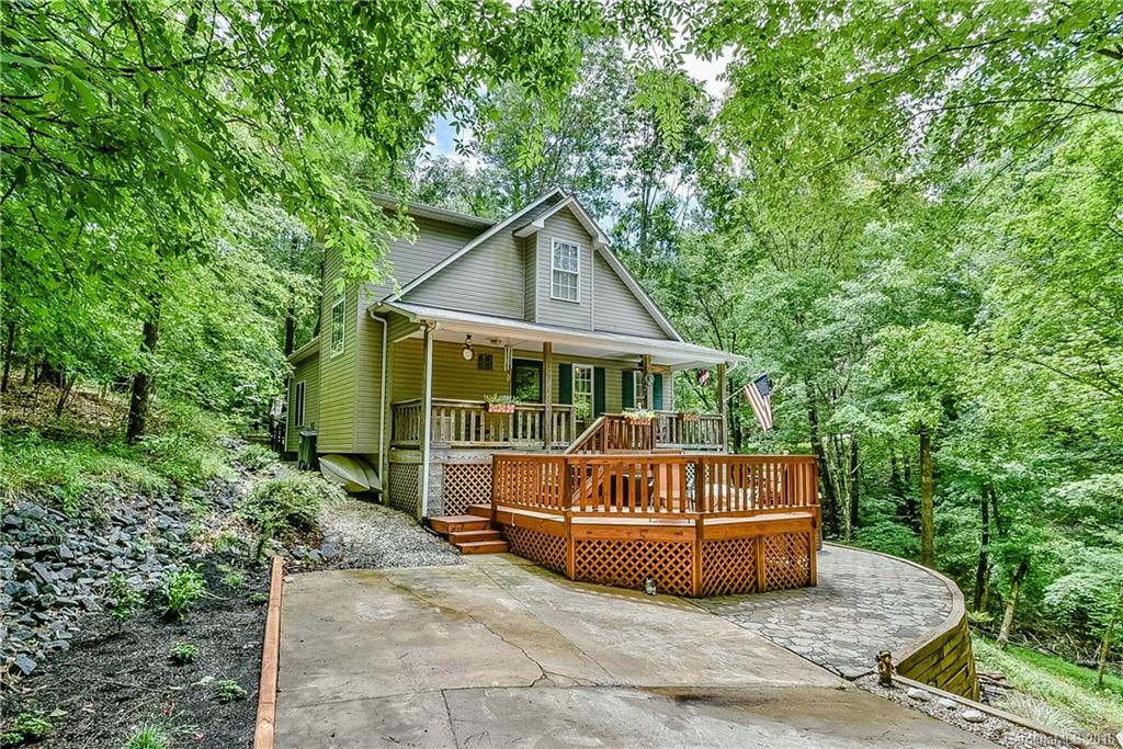 Welcome Home to your private oasis in the woods! Nestled in beautiful Tega Cay, this 3 bedroom 2 bathroom home is quiet and serene. The home sits back off the road on .48 acres that are wooded and tranquil. This home includes a large front porch and 2 decks with great views. Modern swim spa included w/home. Open concept floor plan in the home. Kitchen w/granite, custom paint throughout, charm and elegance galore. Woodshop beneath home. Come see this unique, beautiful home before it is SOLD!