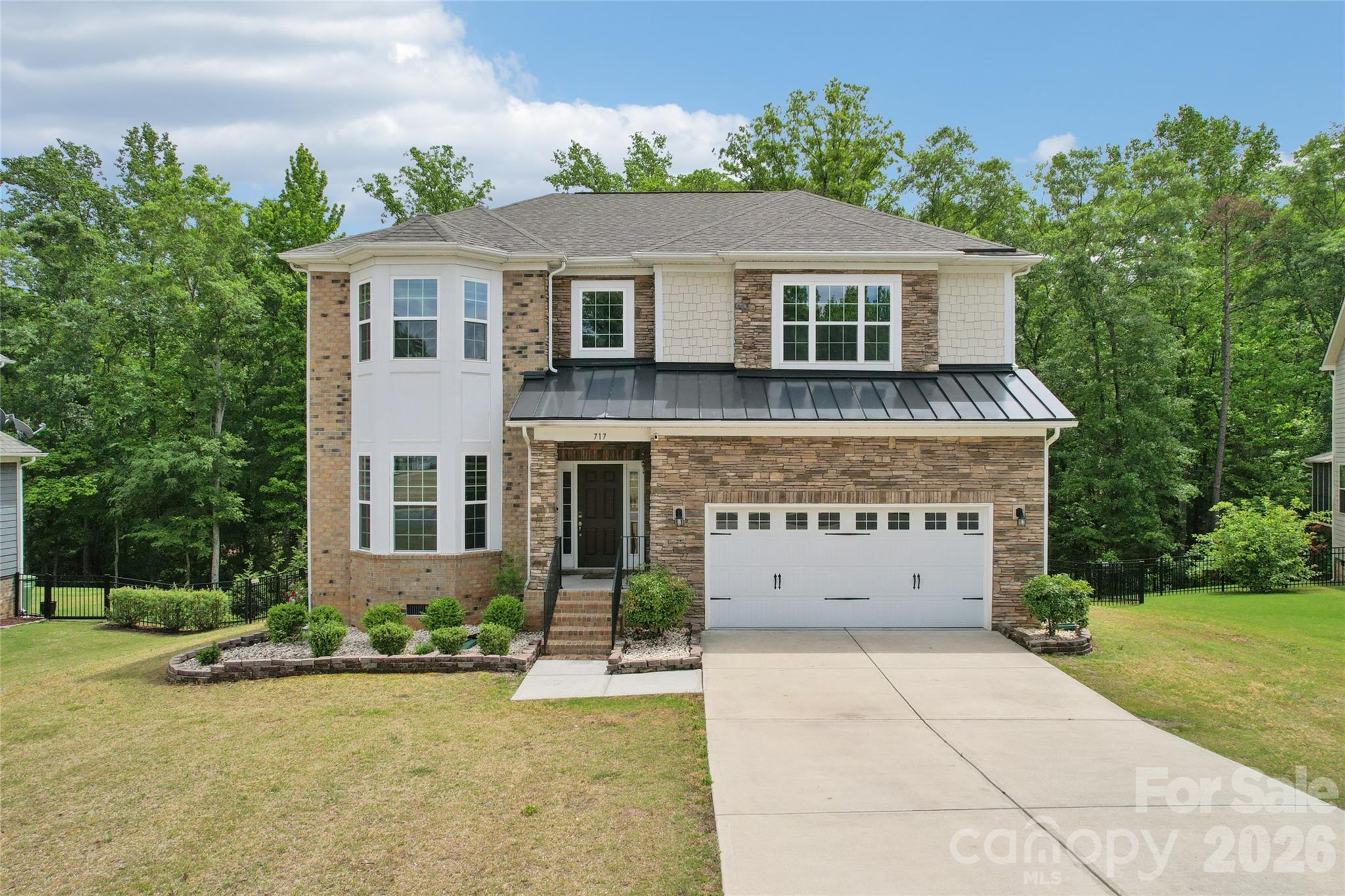 5 bed · 4 bath Gated community, Gourmet kitchen, Main-level guest suite, Top rated Fort Mill schools, Move-in ready, trails, and downtown — all within a mile

Listing description

Welcome to this exceptional 5-bedroom, 4-bathroom single-family home, ideally situated within a sought-after gated community in the heart of Fort Mill, SC. From the moment you arrive, the security and prestige of this neighborhood set the tone for everything that awaits inside.

Premium stainless-steel appliances, a professional gas range and cooktop, and a double oven make cooking a true pleasure, while a tasteful tile backsplash ties the space together with style and sophistication.

Thoughtfully designed for flexible living, the main level includes a guest bedroom and full bath — perfect for visitors, extended family, or a private home office — while a second guest suite upstairs gives the upper level its own sense of luxury and retreat. Natural light pours through generously sized windows throughout, creating warm, inviting spaces that feel both grand and comfortable.

With five spacious bedrooms and four full bathrooms, there's room to live, grow, and entertain without compromise. A huge crawl space provides exceptional extra storage, keeping every living area clean, organized, and clutter-free.

Commuters and weekend adventurers alike will appreciate the unbeatable connectivity — Ballantyne is just approximately 8 miles away, and I-77 is a mere 3.5 miles from your front door, putting Charlotte and beyond well within easy reach. Add to that the highly rated Fort Mill School District, walkable access to the Fort Mill Complex and Anne Springs Close Greenway trails, and the charm of historic downtown Fort Mill just minutes away, and it becomes clear: this home doesn't just check boxes — it raises the bar.

Truly move-in ready and offering a lifestyle that's hard to match, this is Fort Mill living at its absolute finest. Schedule your tour today — homes like this don't last.

Property highlights

Community - Gated community — secure and prestigious

Gourmet kitchen - Gas range, double oven, stainless appliances, tile backsplash

Main level - Guest bedroom + full bath — ideal for visitors or home office

Second guest suite - Second guest suite upstairs

Storage - Huge crawl space for abundant extra storage

Outdoor space - Expansive yard — ideal for entertaining

Condition - Move-in ready with upgraded finishes

Location perks

Zoned for the highly rated Fort Mill School District

0.5 miles to Anne Springs Close Greenway trails

Minutes to historic downtown Fort Mill — shopping and dining at your doorstep

Approximately 8 miles to Ballantyne, About 3.5 miles to I-77 for easy regional access