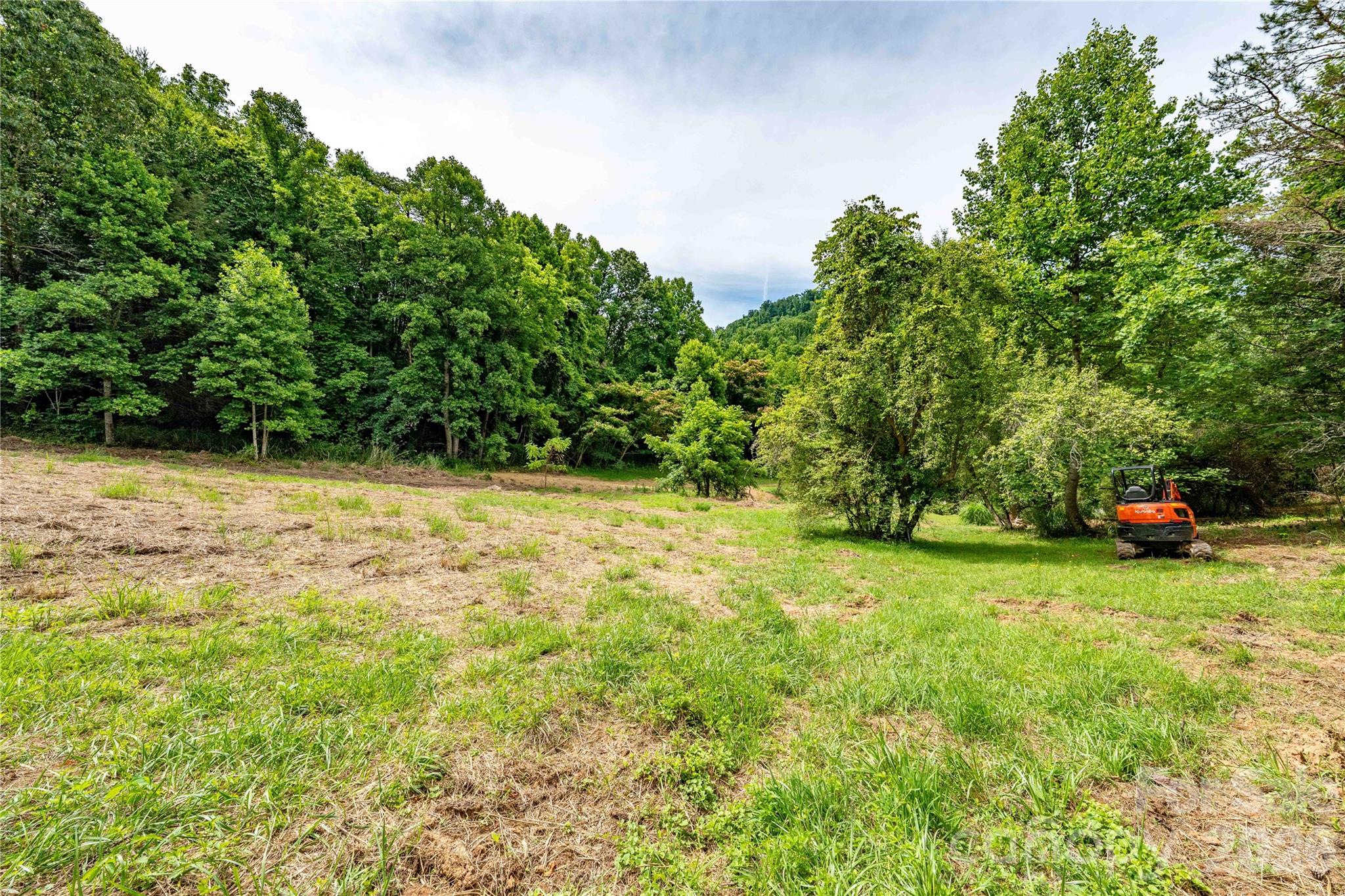 14.7 acres in growing North Buncombe County offering a rare combination of privacy, convenience, and opportunity.  Whether you're seeking a private mountain homestead, family compound, mini-farm or exploring development opportunities, this tract provides the flexibility to bring your vision to life. This parcel offers multiple potential homesites, wooded privacy, and a peaceful natural setting while remaining just minutes from downtown Weaverville and an easy drive to Asheville. Enjoy the best of mountain living with convenient access to shopping, dining, schools, and outdoor recreation. Conveniently located just 10 minutes from downtown Weaverville, 20 minutes from downtown Asheville, and minutes from I-26, offering easy access to shopping, dining, schools, outdoor recreation, and all that Western North Carolina has to offer.