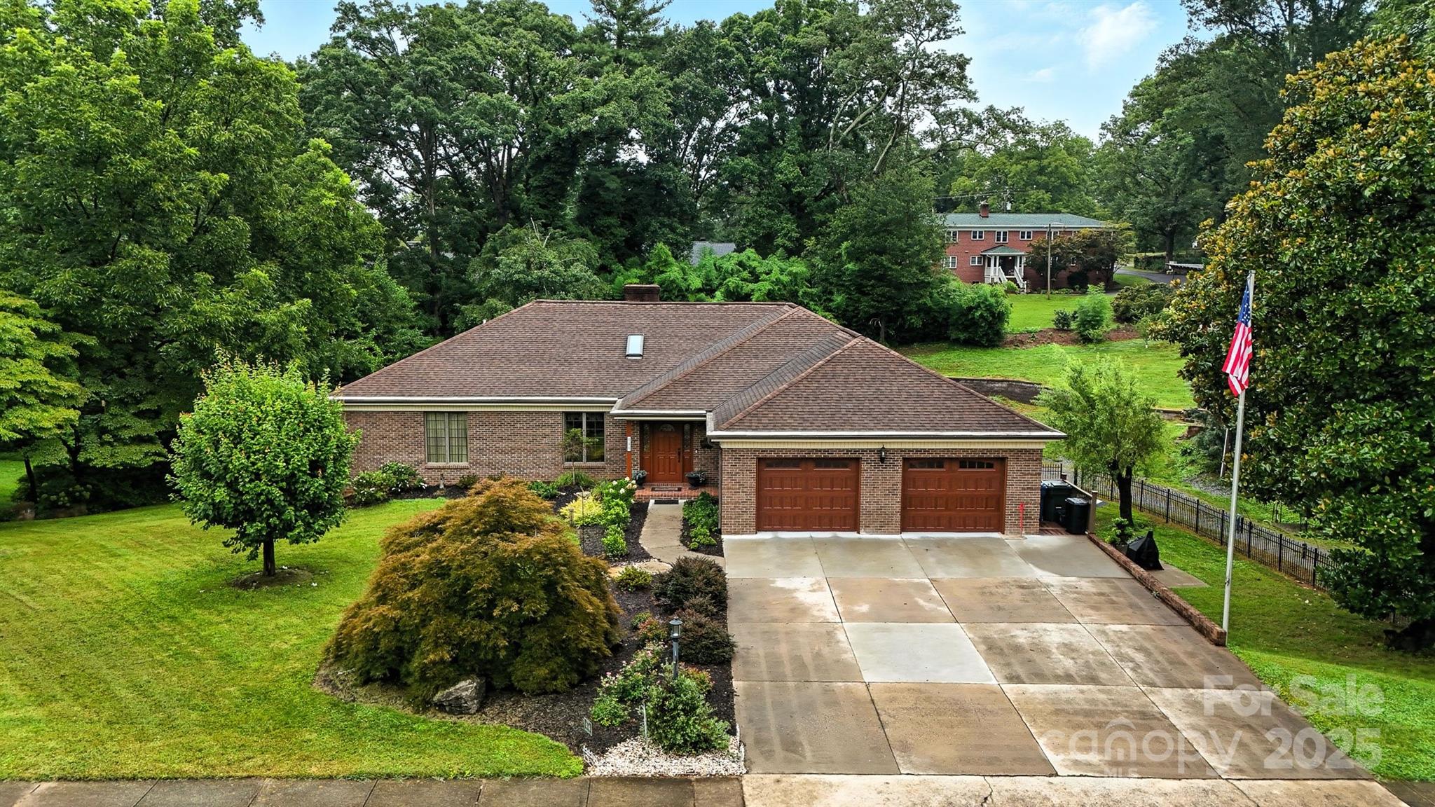 Stately and timeless custom brick ranch with full basement. Includes passive income opportunity with separate 2BR apartment with private side entrance. Spacious well built featuring two main level masters, three kitchens, sunroom, dining room, flex and storage spaces, 4 car garage, 3 laundry rooms, rear deck, covered rear patio and workshop. Large open vaulted LR welcomes you with oversized masonry fireplace. Main kitchen has solid oak cabinets, granite counters, double oven, tile backsplash and breakfast island.  Dining Room has French doors to sunroom and to rear deck. Two primary bedrooms on each end, plus laundry and 3rd Bedroom/office. Basement has 2 flex spaces, Den and storage, plus full bath and laundry room and 2nd kitchen with door to covered rear patio. 2 bedroom apartment includes full kitchen and bath and LR and laundry with private side entrance with concrete patio made for dining table/umbrella. Generator is included. Great location on 5th St NW in historic district.