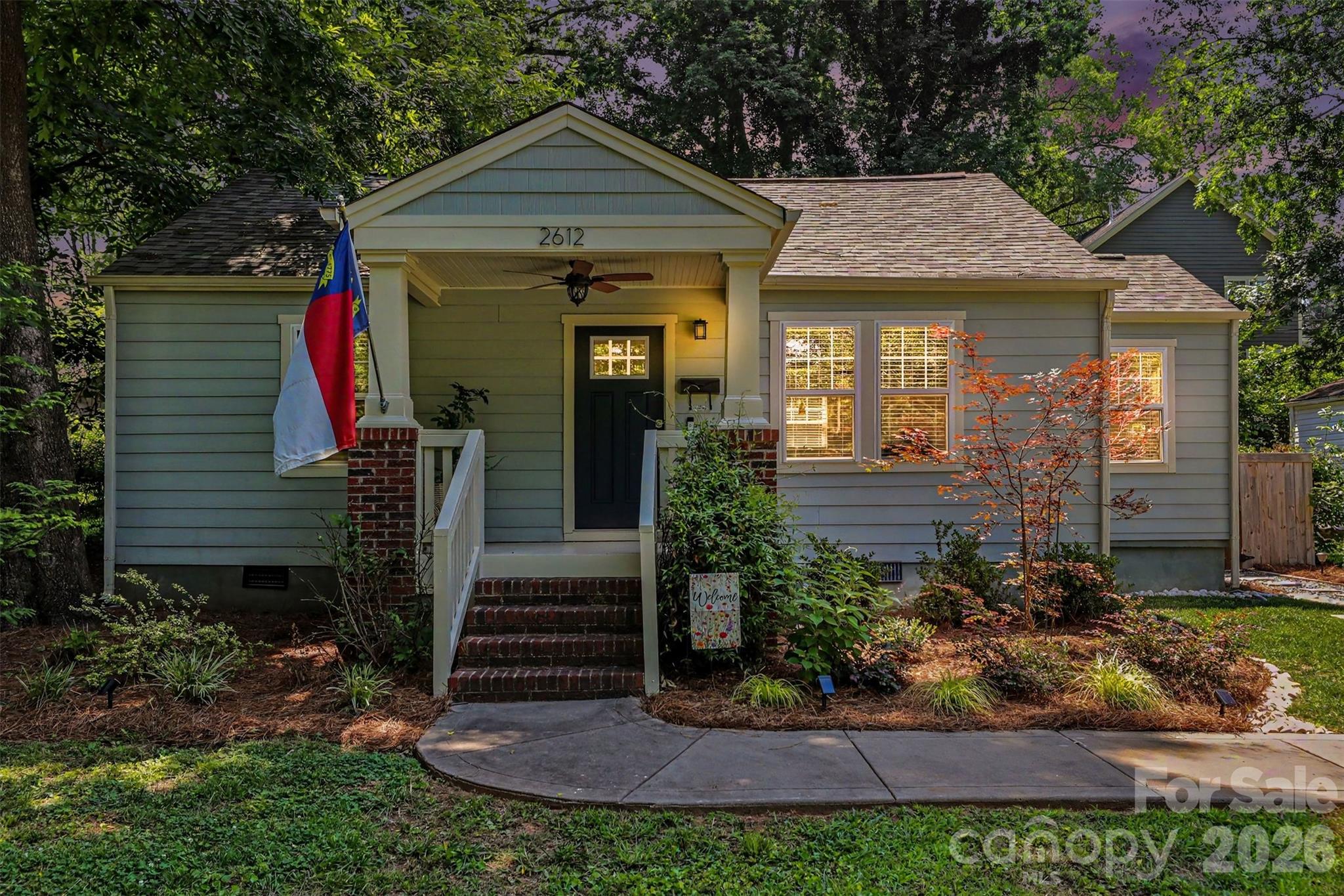Charming, updated, and in the middle of one of Charlotte's most exciting areas, this move-in ready cottage is one you won't want to miss. Located in Historic Smallwood, just minutes from Uptown, Wesley Heights, and Biddleville, this beautifully renovated 2-bedroom, 1-bath home blends original character with thoughtful updates throughout.

Step onto the welcoming covered front porch and into a bright, open living space featuring gorgeous original hardwood floors. The updated kitchen offers stainless steel appliances, neutral cabinetry, and a dedicated laundry area for added convenience. Major improvements including fiber cement siding, NEW architectural shingle roof, and energy-efficient insulated windows provide peace of mind for years to come.

Outside, you'll find a fully fenced backyard that's perfect for entertaining, gardening, pets, or simply enjoying a quiet evening at home. A concrete driveway provides off-street parking for two vehicles.

The location truly sets this home apart. Enjoy being just minutes from Uptown Charlotte and within walking distance to the future Savona Mill Food Hall and the Stewart Creek Greenway. Whether you're grabbing dinner, meeting friends for a drink, hopping on the greenway for a walk or bike ride, or taking advantage of everything West Charlotte's revitalization has to offer, you'll love the lifestyle this location provides.

Don't miss your chance to own a piece of one of Charlotte's fastest-growing neighborhoods.