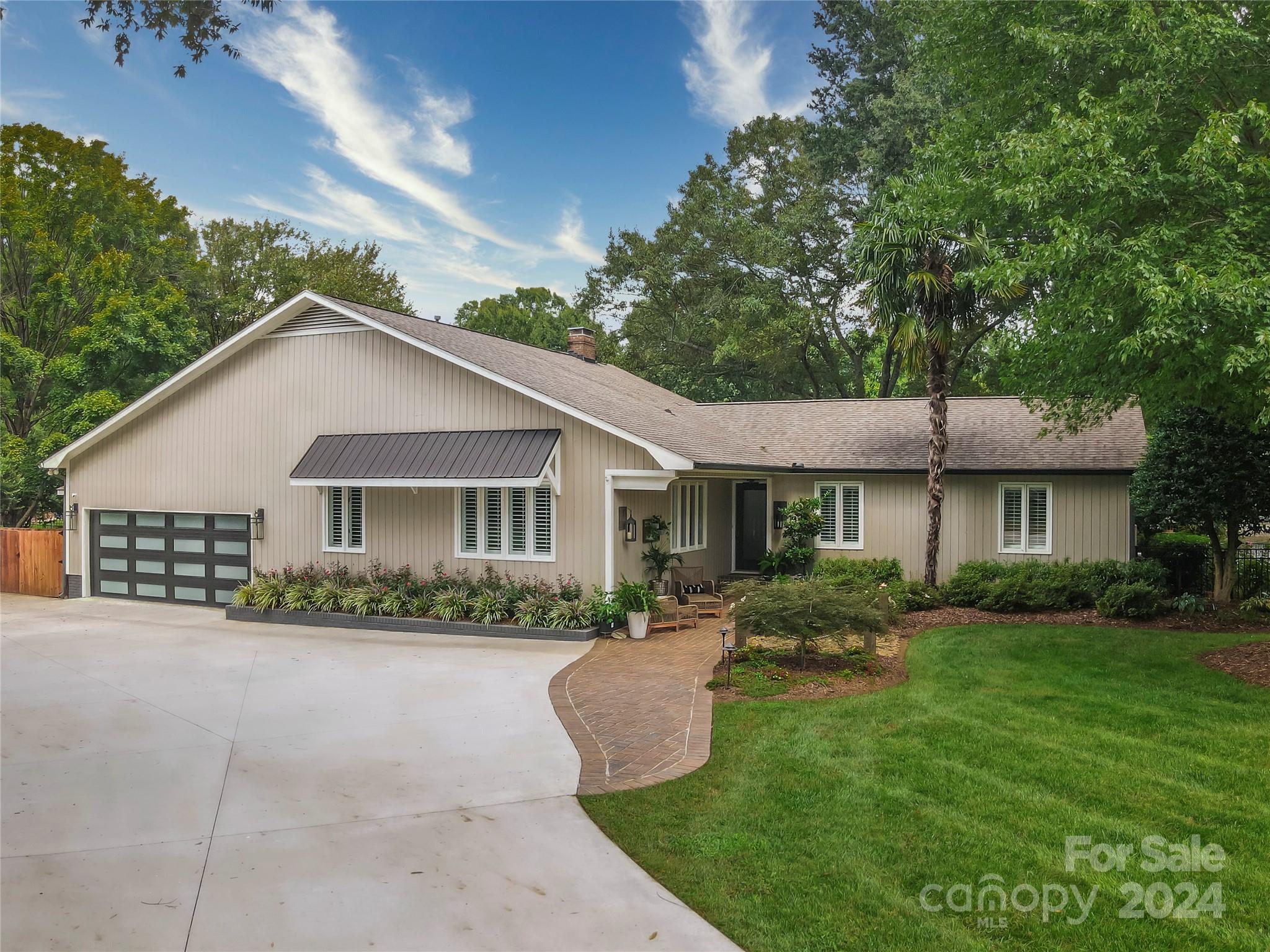 Paradise at the lake! This renovated home is a lake-lover's dream, with a floor plan perfect for entertaining. Open kitchen into the living room, and an outdoor living space that is fit for a crowd, whether you want to watch the games on TV, or get some sun on the deck. Located on a cove that is right in the heart of Cornelius, this home is the perfect location for those that want to explore all the lake has to offer on and off the water, or take a quick drive (or walk or bike ride) to Birkdale in Huntersville.