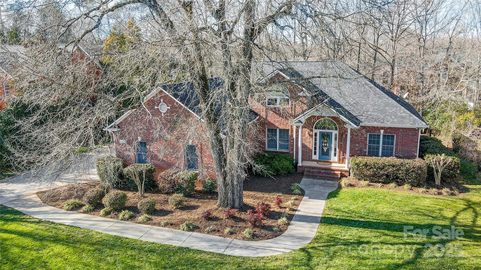 Charming 3-bedroom, 2.5-bathroom ranch home with stunning brick front and beautiful mature trees offering fantastic curb appeal. The spacious open layout includes a cozy living area with a vaulted ceiling and gas logs, and a stunning sunroom filled with windows and gorgeous natural light on repeat, just perfect for entertaining. The main floor features 3 well-sized bedrooms, including a primary suite with an ensuite bath, a secondary full bath, plus an additional half bath for guests. Upstairs, a finished loft provides versatile space for an office, playroom, or extra living area. Enjoy the oversized garage with plenty of room for vehicles and storage, and an expansive back deck—ideal for outdoor gatherings and relaxation. Walk-in storage in multiple locations adds to the home's practicality. New roof and gutters in Fall 2024. Fantastic location just minutes to downtown Rock Hill, Fort Mill, and all that the greater Charlotte area has to offer! Welcome Home to this classic beauty!