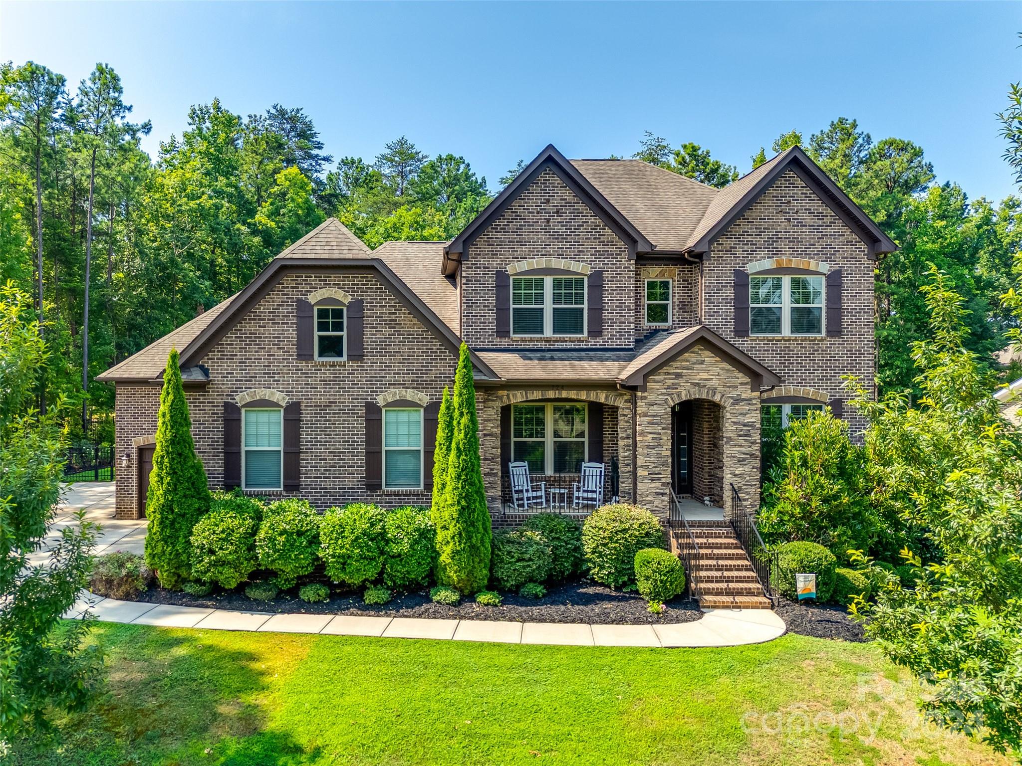 This custom home in Heron Cove is a must see! Enjoy your very own private oasis, lounge in your custom heated pool with hot tub, or enjoy your morning coffee on your screened back porch listening to music from your Sonos surround system. Natural gas line in the backyard so you can grill out on those beautiful Carolina nights. Inside you will fall in love with the large kitchen island, open concept, butlers’ pantry, and custom closets throughout the house. Be prepared to be wowed with the primary closet and bathroom with an oversized shower with dual showerheads. The bonus room can be used as a 5th bedroom, and the home office has a closet as well! sellers have added a new AC unit for downstairs, added additional fencing along the property line, added trees for privacy, new energy efficient variable speed pool motor, and so much more! The 3rd bay of the garage has been fitted with custom shelving, award winning Clover Schools, this house has it all!