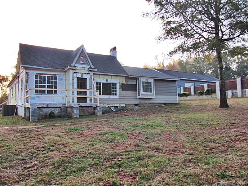 Don't judge a book by its cover! 3 BR/2 BA w/beautifully remodeled interior & a few unfinished improvements left to be made! Exterior is mid-remodel. Gorgeous hardwoods, custom kitchen & baths, open & spacious floor plan! This home comes w/a large garage w/multiple bays & storage over 3000 sq ft- perfect for the hobbyist. Don't miss this rare find! Garage is zoned Residential. Strongly encouraged that offers include proof of funds/pre-approval & is required for seller's final acceptance.