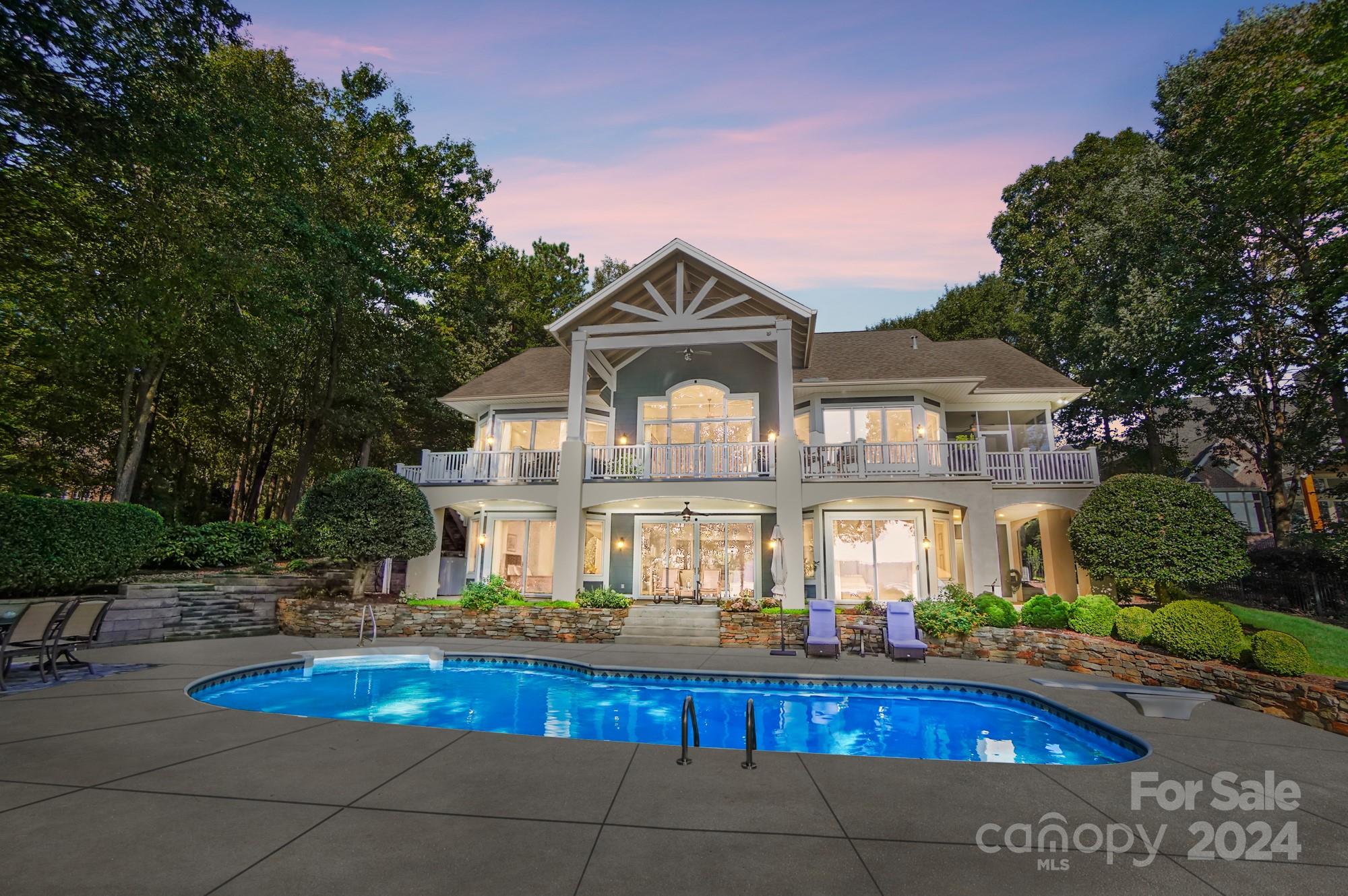 Exceptional Lakefront Home with Stunning Main Channel Views! Discover this breathtaking waterfront home in Sailview, one of Lake Norman's most sought-after communities. This exquisite lake property has undergone extensive renovations, including a completely remodeled kitchen and upgraded bathrooms featuring new sinks, countertops, mirrors, and fixtures. The primary suite is a true retreat, boasting a beautifully updated bathroom and an impressive closet. Recent upgrades include a new water heater and grinder pump installed in 2022, extensive upgrades in the bar entertainment area & laundry room, along with a whole house generator added in 2023. Ask for the full list of upgrades! Step outside to your own private oasis, a spacious, fenced backyard w/ a stunning saltwater pool equipped w/ a new pump. The covered boat dock, complete w/ a boat lift and jet ski lift, is perfect for all your lake adventures. Minutes to all the stores, interstate & entertainment! High-rated school district!