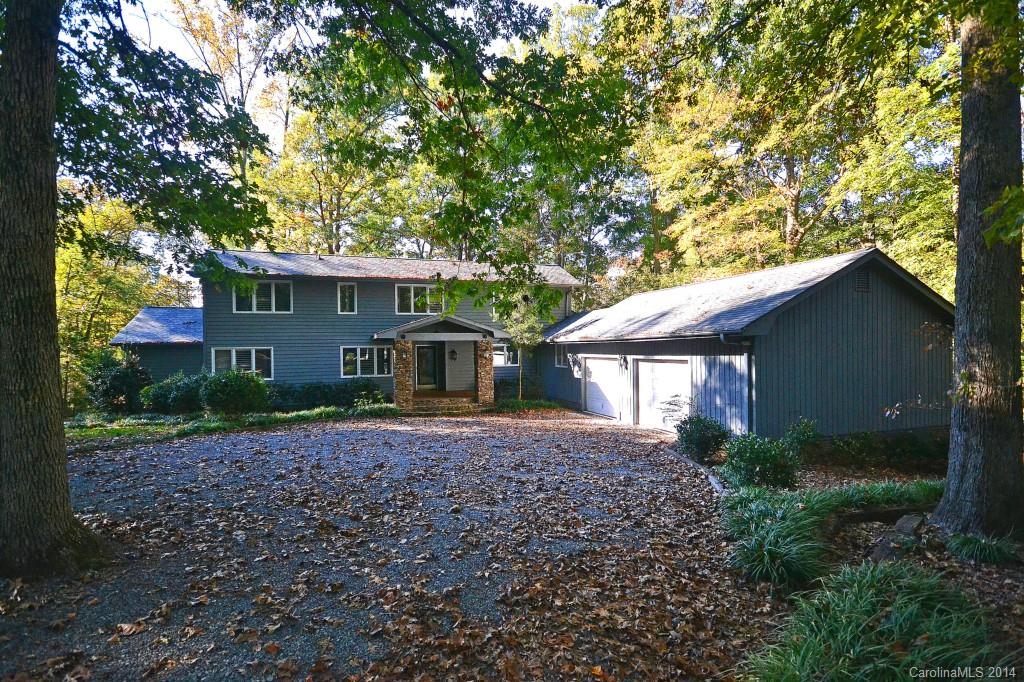 Lake Wylie Waterfront! This beautiful home sits 1.26 acres with 178 feet of waterfront. Dock is in place and walks out to boat house and lovely lake views. Home sits on a wooded lot and features 4 bedrooms, 2.5 baths and a spacious deck. No HOA, lots of room for parking RV and water fun crafts. Second detached garage provides space for work shop or additional parking. Come and enjoy lake life living!