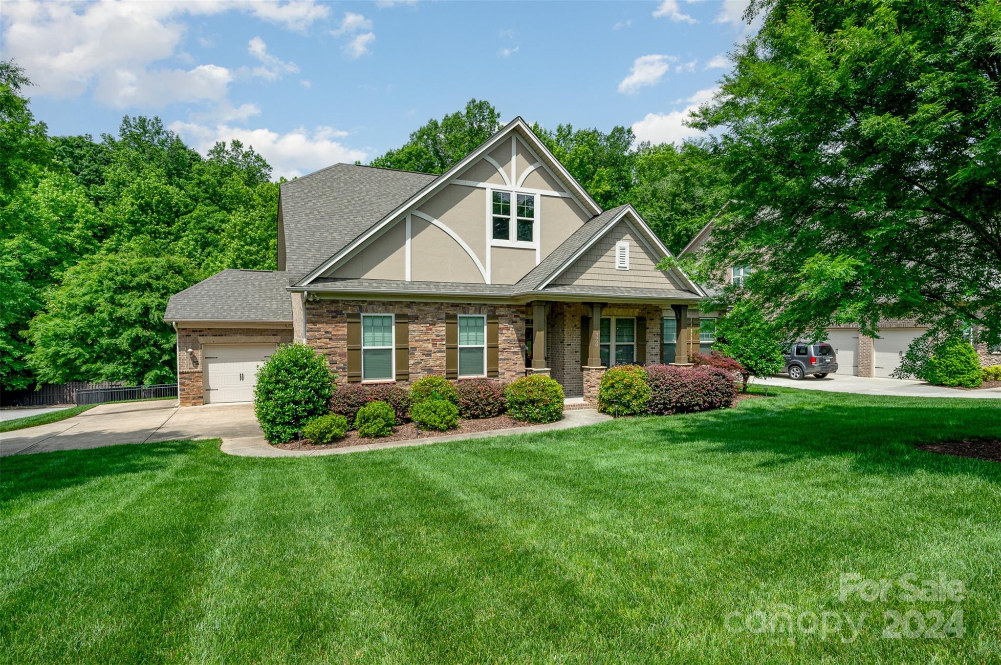 Welcome to this move-in ready 1.5 story full-brick home! The expansive kitchen seamlessly connects to the living area and boasts stainless steel appliances, a gas cooktop, microwave/oven combo, a spacious island with seating, granite countertops, tile backsplash, and recessed lighting. Throughout the main living areas, you'll find gorgeous hardwood floors and a neutral color palette. An eat-in kitchen and formal dining area offers versatile options. The primary bath features an oversized shower with an upgraded door, tile floors, and granite countertops with a double vanity. Upstairs, two bedrooms offer flexibility, perfect for guests or as a bonus space. New Furnace in 2021. Outside, a covered deck overlooks a paver patio, surrounded by lush trees for privacy. Ideally situated in Barber Rock, with easy access to Fort Mill, Indian Land, and Ballantyne, this home epitomizes luxury living. Schedule your showing today!