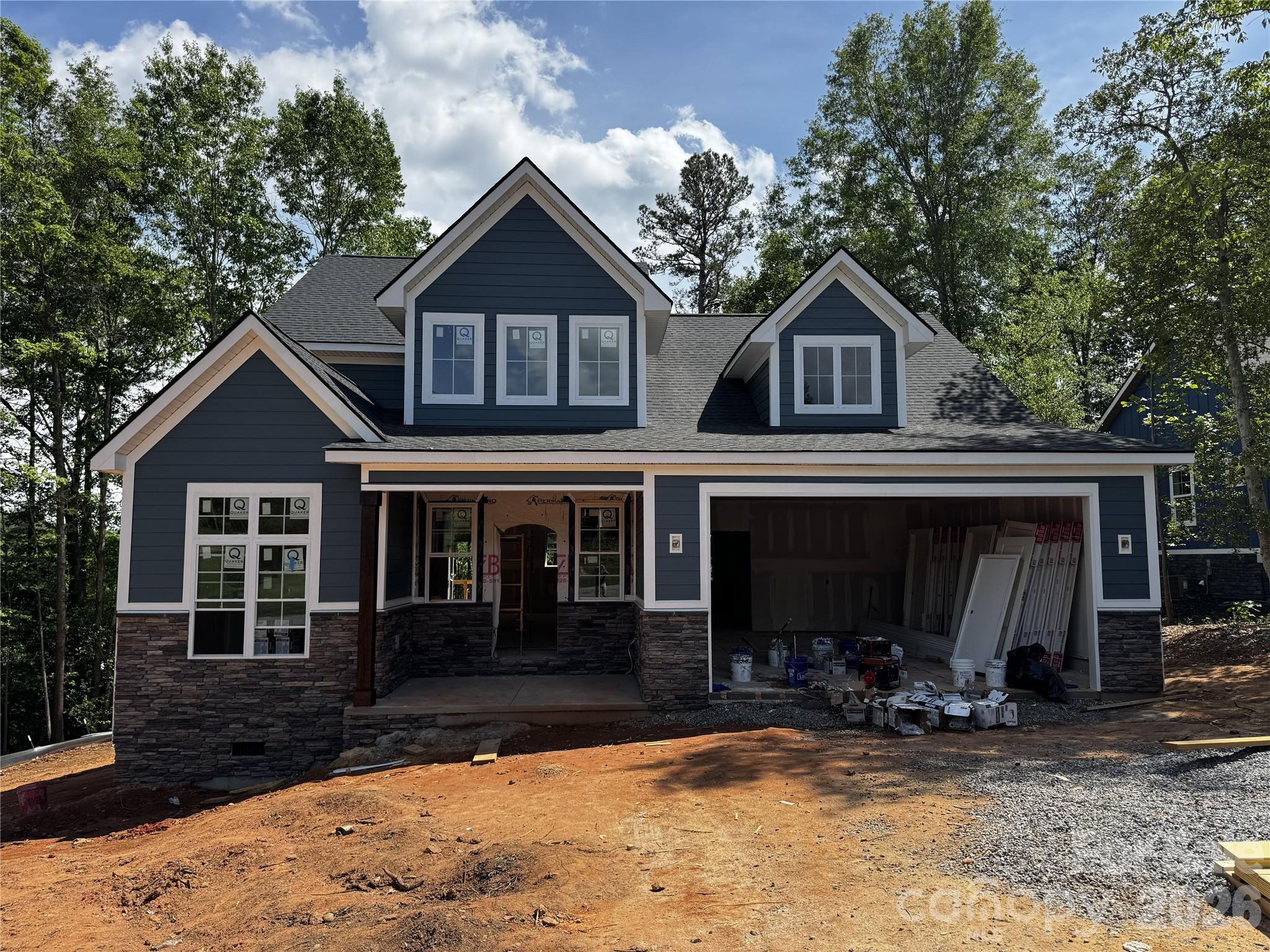 Welcome to refined lakeside living in this stunning new construction hine featuring the sought-after Dunning floor plan. Thoughtfully designed for both elegance and everyday comfort, this 4-bedroom, 2.5 bath residence offers the rare convenience of a main floor primary suite-your private retreat complete with luxury finishes that set the tone for the entire home.
Step inside to an open, light-filled floor plan where the great room flows seamlessly into a designer kitchen appointed with high-end fixtures, premium cabinetry, and finishes that today's discerning buyer expects. Whether you're hosting an intimate dinner or a lively gathering, this space delivers.
Extend your living outdoors onto the covered porch, where morning coffee and evening sunsets become a daily ritual. The attached garage adds everyday convenience without compromising the home's celan, polished curb appeal. 
What truly sets this property apart is access to the neighborhood boat launch and dock-putting you on the water whenever the mood strikes. Enjoy the best of Western North Carolina's lake lifestyle just steps from your front door. 
This home is more than a home, its a lifestyle upgrade.