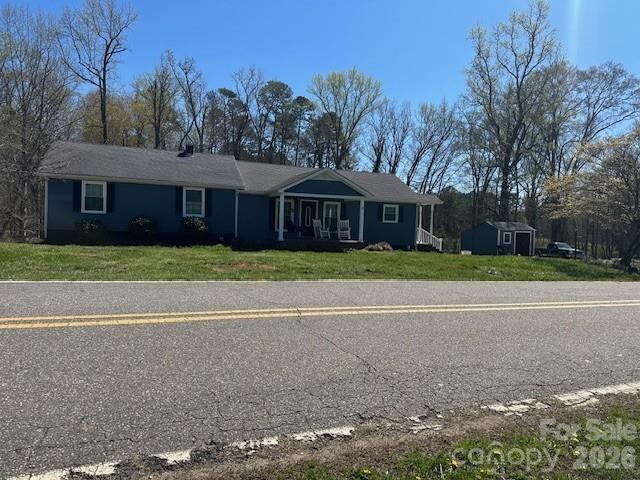 Just minutes from the charming town of Dallas, NC, this beautifully remodeled 3 bedroom, 2 bath ranch offers the perfect blend of quiet country living and convenient access to nearby shopping and amenities. Sitting on nearly an acre, the property features a gently rolling backyard, a concrete driveway leading to a storage building with lean to, and a handyman’s dream workshop in the finished partial basement.
Inside, the home welcomes you with a warm, cozy, and intimate atmosphere — all main living areas on one level, with the basement accessible from the rear of the home. Thoughtful updates, comfortable spaces, and a layout designed for easy living make this property truly special. From the moment you step inside, you’ll feel the charm and character that make this home a rare find and a jewel worth claiming.