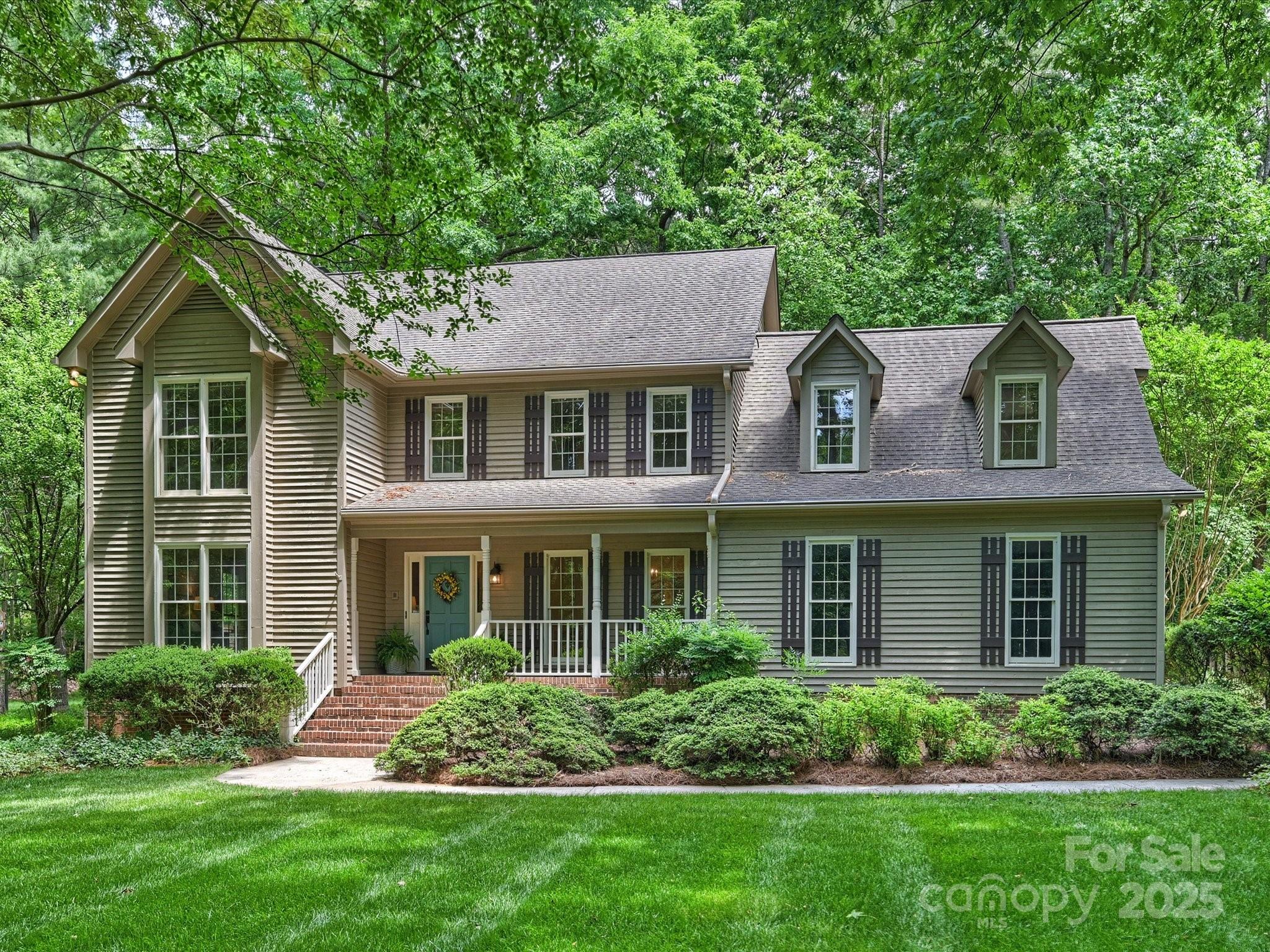 Lovely home on private wooded lot in the popular Providence Plantation neighborhood, Enjoy this quiet, peaceful lifestyle.  Well cared for with updates throughout. Carpet recently replaced. Kitchen remodel includes custom cabinets, granite and stainless steel appliances. Additional counters and cabinets added. Formal dining room and spacious living room with floor to ceiling windows. Family room includes wood burning fireplace and coffered ceiling. Upstairs hall bath recently updated with tall dual white vanity and cabinets, new tile floor and tub surround and new toilet. Large primary and bath with rimless shower. Spacious bonus with closets for storage.  Private treed view from oversized deck.  Yard extends approx 30 feet beyond the fence. Beautiful neighborhood convenient to Providence Promenade, Arboretum and Hwy 485. Top rated schools and membership to Providence Plantation Swim & Racquet available. Convenient to Raintree Country Club which includes golf.