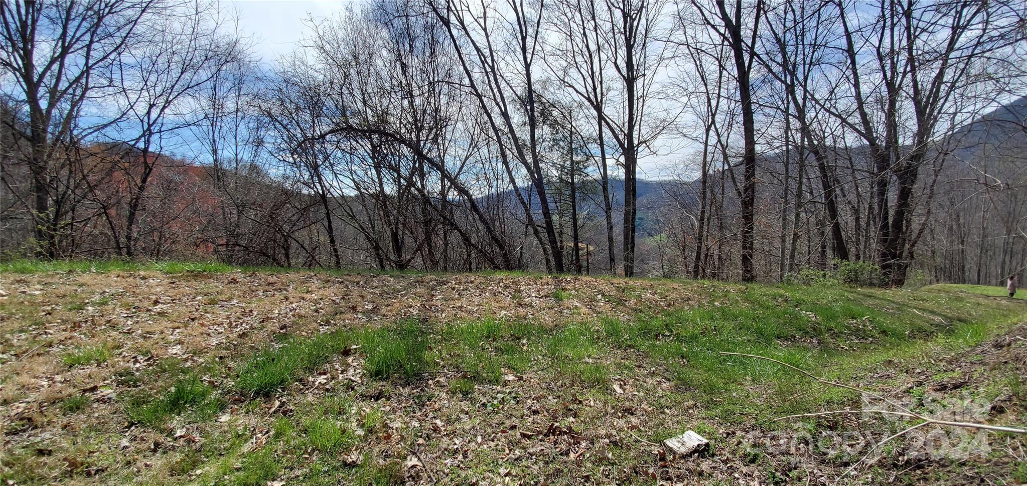 Exclusive lot in Desirable Sunset Falls at Bald Creek. Lot 6 offers an incredible opportunity to own a private 2.28 acre, gently sloped lot with great 270 degree views and it truly is the best value within the community. 
This lot can be sold in combination with adjacent lots (9/12) and make it a private compound of 7.45 acres. Sunset Falls is an exclusive low density gated community nestled within the heart of the Blue Ridge Mountains of Western North Carolina just 40 minutes west of downtown Asheville and 20 minutes northeast of Main Street in Waynesville with close proximity to a range of outdoor recreational opportunities: rafting, kayaking, canoeing, fly-fishing, hiking, mountain-biking, skiing, snowboarding, hot-air ballooning, hunting, skeet-shooting, etc. This mountain is comprised of approximately 150 acres and includes 30 home sites, surrounded by 292 acres of preserved land owned by The Southern Appalachian Highlands Conservancy on both its northern and eastern boundaries.