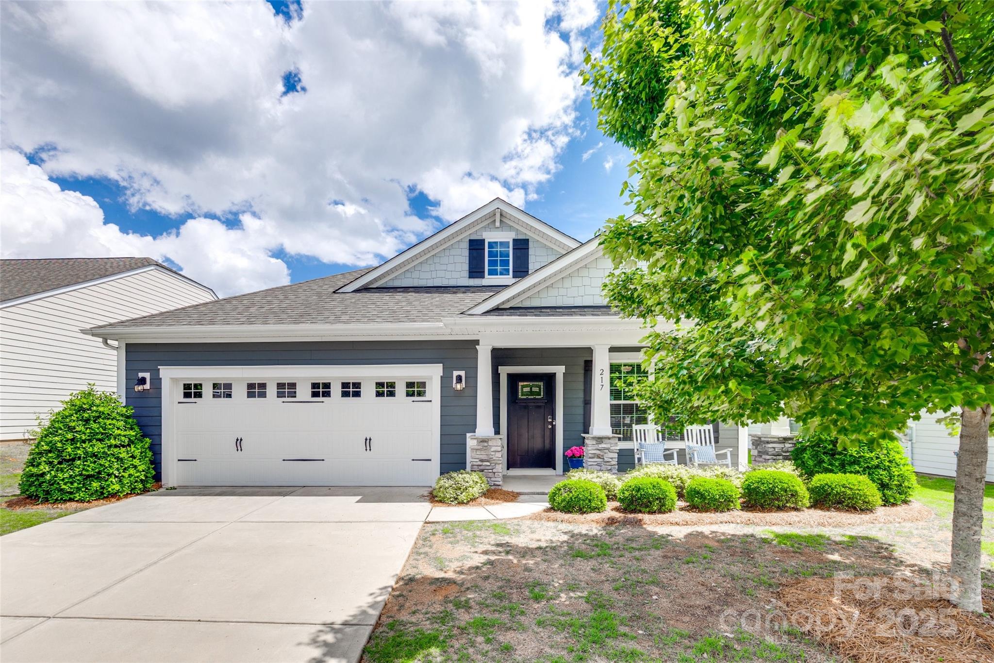 Craftsman charm meets modern living in this move in ready home located in one of Belmont’s most sought-after communities! This home offers a fabulous open floor plan, which is ideal for everyday living & entertaining too. You’ll find thoughtful design details like board & batten in the entry, a very spacious bright white kitchen with a large island that opens seamlessly to the living area featuring a gas log fireplace. Your living space is extended outdoors with the screened-in porch perfect for enjoying your morning coffee or hosting guests. Did we mention the flex space just off the foyer which is ideal for a home office or study?  Retreat to the spacious primary suite, complete with a double vanity and a large tile walk-in shower.  New carpet in bedrooms. With HOA included lawn care, you’ll enjoy low-maintenance living allowing more time to take advantage of The Conservancy’s amenities & beautiful surroundings. Stop looking and start unpacking today!