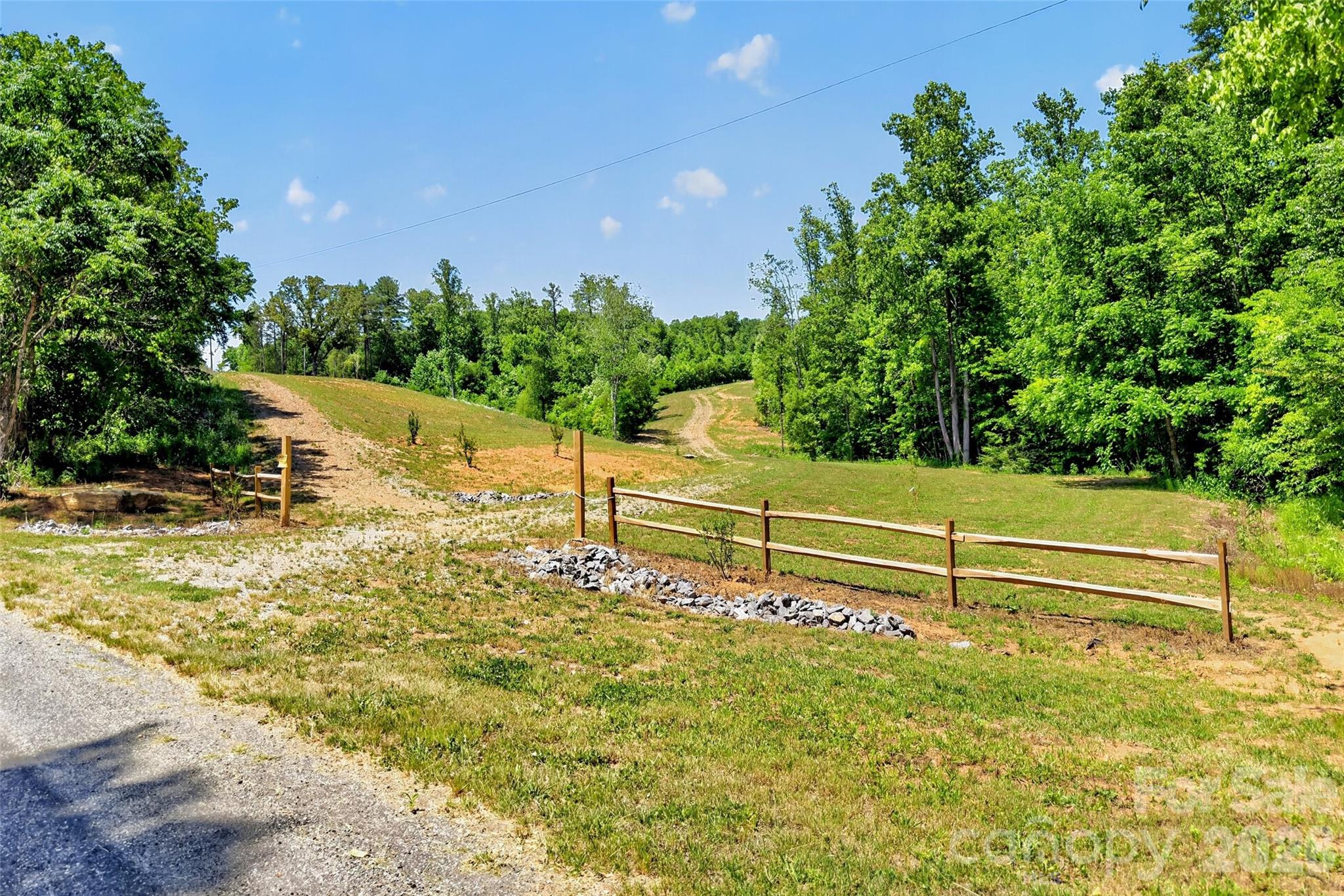 33± acres of opportunity with stunning mountain views and endless potential! This versatile property offers 300 degree views and has already been perc tested, hydro seeded, graded, and cleared for a 3-bedroom home, with septic and well permits making it ready for your vision to come to life. Whether you’re looking to build a private estate, create a multi-family retreat, develop investment properties, or explore commercial possibilities, this property offers flexibility rarely found in such a prime location. Conveniently located just off I-40 and less than 10 minutes from town and the hospital, you’ll enjoy easy access to shopping, dining, and amenities while still experiencing the peace, privacy, and tranquility of mountain living. Don’t miss this rare chance to own a beautiful piece of land with breathtaking views and unlimited possibilities. The area shown in the map is an estimated line based off of a pervious survey. The seller will get a servey done before closing.