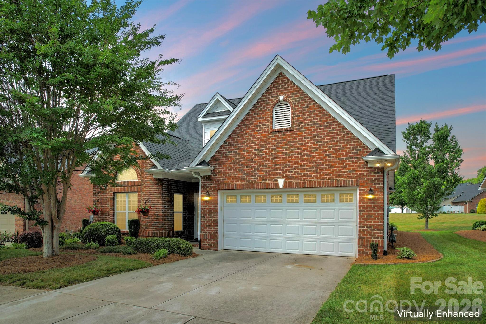This inviting all-brick 2500+ home in Turnberry at Boxwood Village offers the perfect blend of comfort, space, and low maintenance living. The main-level primary suite features two walk-in closets and an updated bath, while the kitchen shines with granite, tile backsplash, and stainless-steel appliances. A vaulted living room with a gas fireplace opens to a sunroom overlooking a quiet common area-an ideal spot for morning coffee or a five o'clock somewhere at the end of the day. Upstairs, a generous loft, two bedrooms, and a full bath provide flexible space for guests or work-from-home needs. With two floored attic spaces, a fenced patio included window treatments, and HOA-maintained yard care, this home is designed for easy living. Walk to local favorites like Ketchie Creek Bakery and nearby shopping. This beauty is a must see! *New Roof in 2023.
