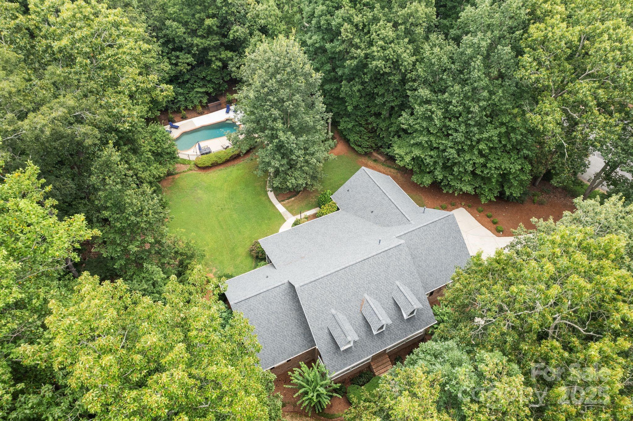 Tucked away in a quiet cul-de-sac in the established West Pointe community, this full-brick ranch sits on over two acres and lives large—indoors and out. With four bedrooms on the main level and a bonus room over the garage, the layout works for a variety of lifestyles, from everyday household rhythms to work-from-home flexibility. Thoughtfully maintained and move-in ready, the home blends quality craftsmanship, privacy, and comfortable design that is both useful and intentional. Enjoy Lake Wylie by day and your own saltwater pool by night. Whether you're sipping something sweet in the screened sunroom or covered back porch, there’s room to unwind, entertain, or just breathe. A sealed crawlspace, newer roof and mechanical systems, and no HOA round out the package. Located minutes from Lake Wylie, commuter routes, and top-rated Clover schools, this one checks all the boxes-There’s more to this home than we can fit here—and it’s worth asking about. Recent appraisal $891k!